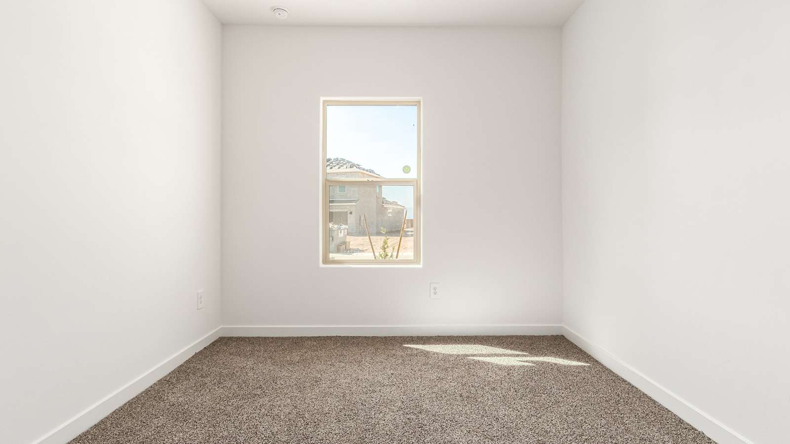 Welcome to Tortolita Trails, where luxury meets nature in the serene surroundings of Dove Mountain, Marana, Arizona. The Baxter is a well-conceived new home within this exclusive community, offering 1,423 square feet of pure comfort and convenience. This three-bedroom, two-bathroom home is designed to fit the needs of modern living while blending seamlessly with the natural beauty of its surroundings.  Upon entering The Baxter, you'll be greeted by a spacious great room that flows effortlessly into the dining area and kitchen, making it an ideal space for gatherings. The kitchen, with its large pantry, modern appliances, and ample counter space, is the heart of this home, ready to handle everything from weeknight dinners to holiday feasts. The adjacent dining area opens to a covered patio, perfect for enjoying the beautiful Arizona evenings.  The primary bedroom is a true haven, featuring a walk-in closet and an en-suite bathroom that offers both privacy and functionality. The additional two bedrooms are well-sized, providing flexibility for family, guests, or a home office. With a three-car garage, you'll have plenty of space for vehicles, storage, or even a workshop.  The Baxter also includes a range of standard features that enhance everyday living. Enjoy energy-efficient construction that not only reduces your carbon footprint but also lowers utility bills. The home is equipped with advanced insulation, energy-efficient windows, and smart home technology, ensuring comfort and convenience year-round.  Living in Tortolita Trails means you’re part of a community that values both luxury and sustainability. With access to extensive walking trails, parks, and outdoor activities, as well as proximity to top-rated schools and essential amenities, The Baxter offers a lifestyle that’s hard to match.  Come home to The Baxter at Tortolita Trails, where every detail is designed to enhance your everyday life while allowing you to enjoy the natural beauty of Arizona to the fullest.