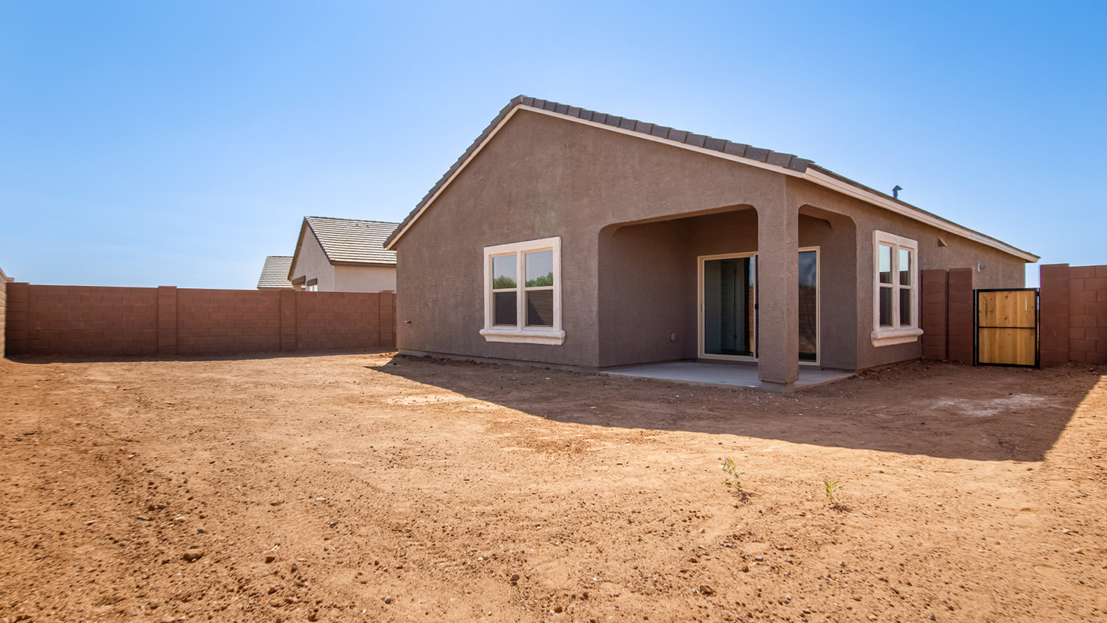 Welcome to Tortolita Trails, where luxury meets nature in the serene surroundings of Dove Mountain, Marana, Arizona. The Baxter is a well-conceived new home within this exclusive community, offering 1,423 square feet of pure comfort and convenience. This three-bedroom, two-bathroom home is designed to fit the needs of modern living while blending seamlessly with the natural beauty of its surroundings.  Upon entering The Baxter, you'll be greeted by a spacious great room that flows effortlessly into the dining area and kitchen, making it an ideal space for gatherings. The kitchen, with its large pantry, modern appliances, and ample counter space, is the heart of this home, ready to handle everything from weeknight dinners to holiday feasts. The adjacent dining area opens to a covered patio, perfect for enjoying the beautiful Arizona evenings.  The primary bedroom is a true haven, featuring a walk-in closet and an en-suite bathroom that offers both privacy and functionality. The additional two bedrooms are well-sized, providing flexibility for family, guests, or a home office. With a three-car garage, you'll have plenty of space for vehicles, storage, or even a workshop.  The Baxter also includes a range of standard features that enhance everyday living. Enjoy energy-efficient construction that not only reduces your carbon footprint but also lowers utility bills. The home is equipped with advanced insulation, energy-efficient windows, and smart home technology, ensuring comfort and convenience year-round.  Living in Tortolita Trails means you’re part of a community that values both luxury and sustainability. With access to extensive walking trails, parks, and outdoor activities, as well as proximity to top-rated schools and essential amenities, The Baxter offers a lifestyle that’s hard to match.  Come home to The Baxter at Tortolita Trails, where every detail is designed to enhance your everyday life while allowing you to enjoy the natural beauty of Arizona to the fullest.