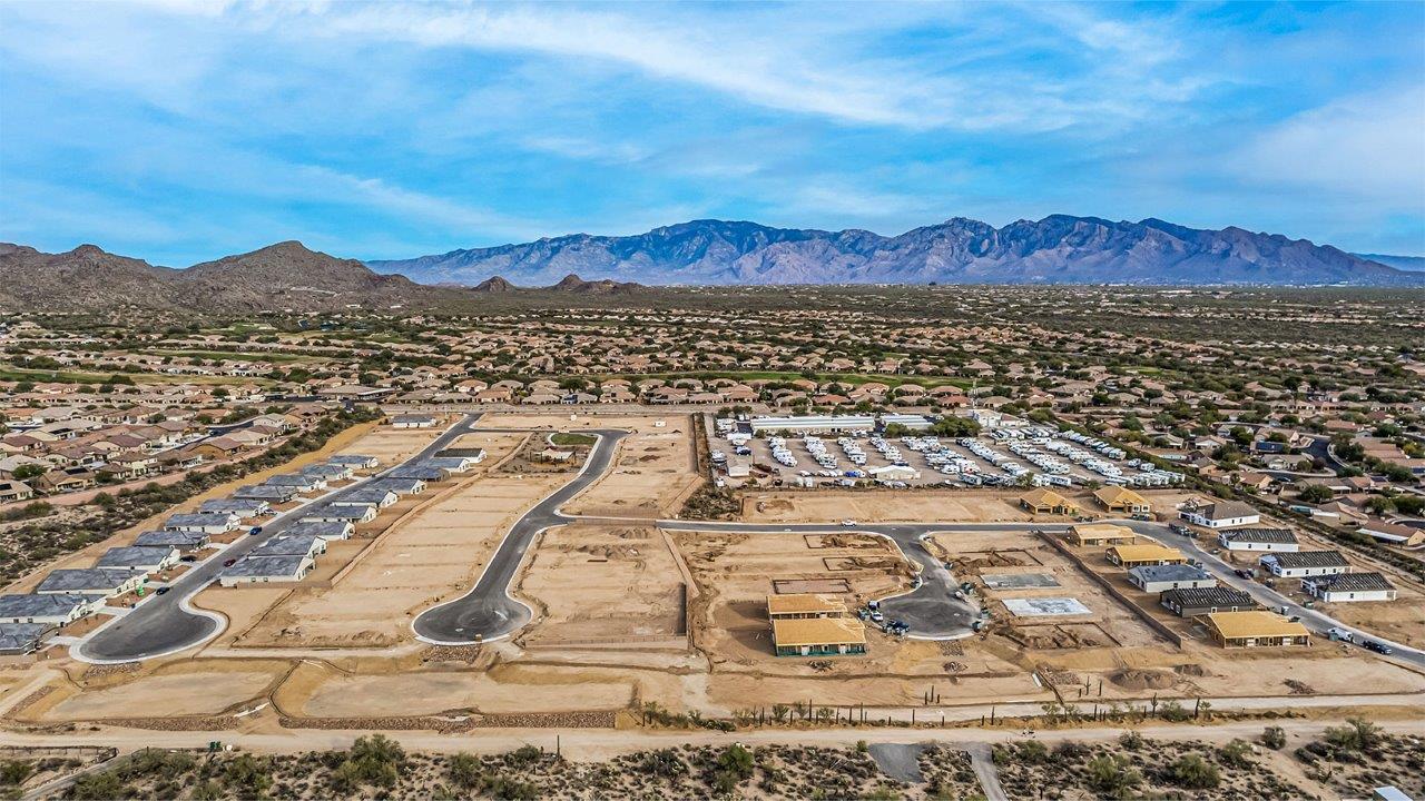 Welcome to Tortolita Trails, where luxury meets nature in the serene surroundings of Dove Mountain, Marana, Arizona. The Baxter is a well-conceived new home within this exclusive community, offering 1,423 square feet of pure comfort and convenience. This three-bedroom, two-bathroom home is designed to fit the needs of modern living while blending seamlessly with the natural beauty of its surroundings.  Upon entering The Baxter, you'll be greeted by a spacious great room that flows effortlessly into the dining area and kitchen, making it an ideal space for gatherings. The kitchen, with its large pantry, modern appliances, and ample counter space, is the heart of this home, ready to handle everything from weeknight dinners to holiday feasts. The adjacent dining area opens to a covered patio, perfect for enjoying the beautiful Arizona evenings.  The primary bedroom is a true haven, featuring a walk-in closet and an en-suite bathroom that offers both privacy and functionality. The additional two bedrooms are well-sized, providing flexibility for family, guests, or a home office. With a three-car garage, you'll have plenty of space for vehicles, storage, or even a workshop.  The Baxter also includes a range of standard features that enhance everyday living. Enjoy energy-efficient construction that not only reduces your carbon footprint but also lowers utility bills. The home is equipped with advanced insulation, energy-efficient windows, and smart home technology, ensuring comfort and convenience year-round.  Living in Tortolita Trails means you’re part of a community that values both luxury and sustainability. With access to extensive walking trails, parks, and outdoor activities, as well as proximity to top-rated schools and essential amenities, The Baxter offers a lifestyle that’s hard to match.  Come home to The Baxter at Tortolita Trails, where every detail is designed to enhance your everyday life while allowing you to enjoy the natural beauty of Arizona to the fullest.