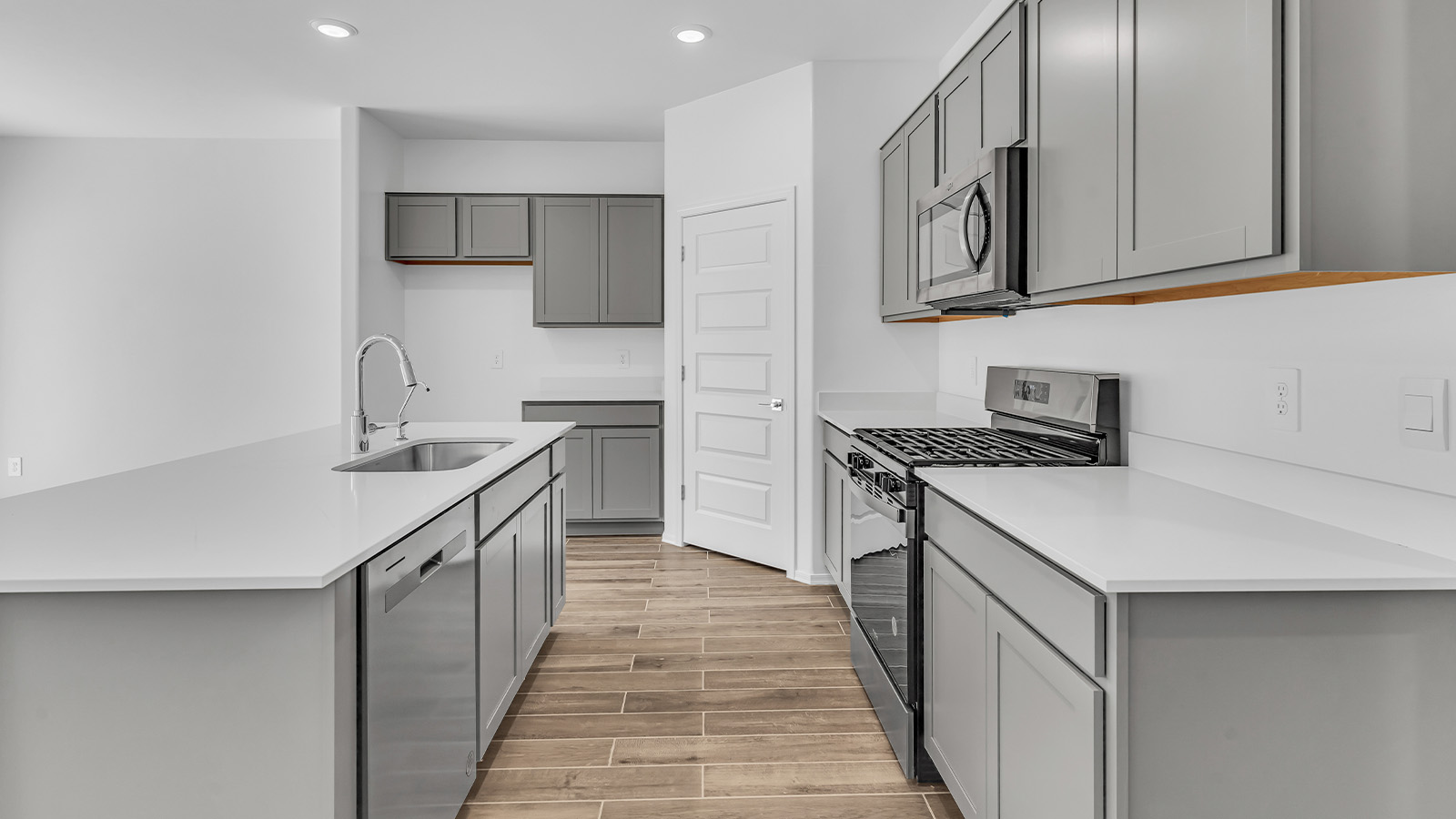 Discover the essence of Arizona living at Tortolita Trails, where The Cali plan offers an inviting blend of comfort and style. This 1,823 square foot single-story new home, located in the prestigious Dove Mountain area of Marana, Arizona, is designed to accommodate the needs of modern families. With four bedrooms and two bathrooms, The Cali provides ample space for relaxation, entertaining, and everything in between.  Step inside and be greeted by an open-concept layout that seamlessly connects the kitchen, dining room, and great room, creating a spacious environment perfect for gatherings. The kitchen, featuring a large pantry, modern appliances, and ample counter space, is a home chef's dream. The adjoining great room, with easy access to a covered patio, invites you to extend your living space outdoors, perfect for enjoying Arizona’s year-round sunshine.  The private primary suite is a true highlight, offering a spacious bedroom, a walk-in closet, and a bathroom complete with dual sinks and a large shower. Three additional bedrooms provide versatility for family members, guests, or a home office setup. A second bathroom, conveniently located near these bedrooms, ensures comfort for all.  In The Cali, you'll find a range of high-quality standard features that elevate your living experience. The home includes a modern kitchen with a large pantry, quartz countertops, stylish cabinetry, and energy-efficient appliances. The great room, designed for both comfort and functionality, connects seamlessly to the dining area and kitchen, creating an ideal space for entertaining. The covered patio offers an inviting outdoor retreat, perfect for enjoying Arizona's beautiful weather. Additionally, the home includes a two-car garage, providing ample storage and parking space.  Practicality meets style in The Cali, with thoughtful design elements like a utility room, abundant storage, and a two-car garage. Energy-efficient features throughout the home ensure that you can enjoy your space comfortably while keeping utility costs low.  Outside, Tortolita Trails offers a community atmosphere enriched with scenic views, recreational trails, and proximity to top-rated schools, shopping, and dining options. Whether you’re relaxing on the covered patio or exploring the surrounding natural beauty, The Cali at Tortolita Trails provides the perfect balance of modern living and outdoor adventure.