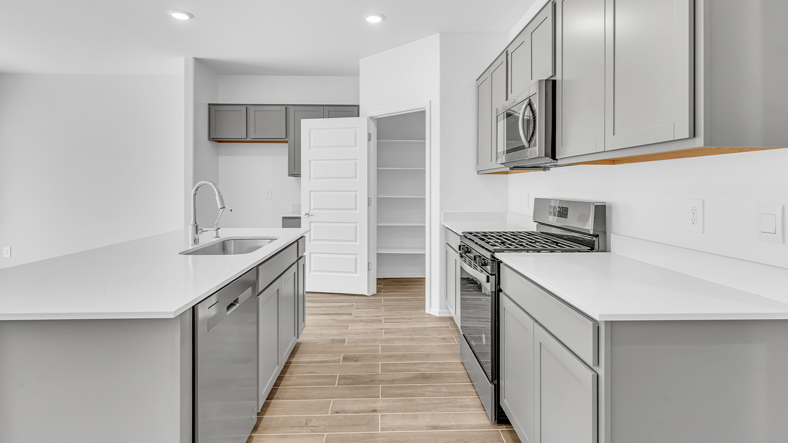 Discover the essence of Arizona living at Tortolita Trails, where The Cali plan offers an inviting blend of comfort and style. This 1,823 square foot single-story new home, located in the prestigious Dove Mountain area of Marana, Arizona, is designed to accommodate the needs of modern families. With four bedrooms and two bathrooms, The Cali provides ample space for relaxation, entertaining, and everything in between.  Step inside and be greeted by an open-concept layout that seamlessly connects the kitchen, dining room, and great room, creating a spacious environment perfect for gatherings. The kitchen, featuring a large pantry, modern appliances, and ample counter space, is a home chef's dream. The adjoining great room, with easy access to a covered patio, invites you to extend your living space outdoors, perfect for enjoying Arizona’s year-round sunshine.  The private primary suite is a true highlight, offering a spacious bedroom, a walk-in closet, and a bathroom complete with dual sinks and a large shower. Three additional bedrooms provide versatility for family members, guests, or a home office setup. A second bathroom, conveniently located near these bedrooms, ensures comfort for all.  In The Cali, you'll find a range of high-quality standard features that elevate your living experience. The home includes a modern kitchen with a large pantry, quartz countertops, stylish cabinetry, and energy-efficient appliances. The great room, designed for both comfort and functionality, connects seamlessly to the dining area and kitchen, creating an ideal space for entertaining. The covered patio offers an inviting outdoor retreat, perfect for enjoying Arizona's beautiful weather. Additionally, the home includes a two-car garage, providing ample storage and parking space.  Practicality meets style in The Cali, with thoughtful design elements like a utility room, abundant storage, and a two-car garage. Energy-efficient features throughout the home ensure that you can enjoy your space comfortably while keeping utility costs low.  Outside, Tortolita Trails offers a community atmosphere enriched with scenic views, recreational trails, and proximity to top-rated schools, shopping, and dining options. Whether you’re relaxing on the covered patio or exploring the surrounding natural beauty, The Cali at Tortolita Trails provides the perfect balance of modern living and outdoor adventure.