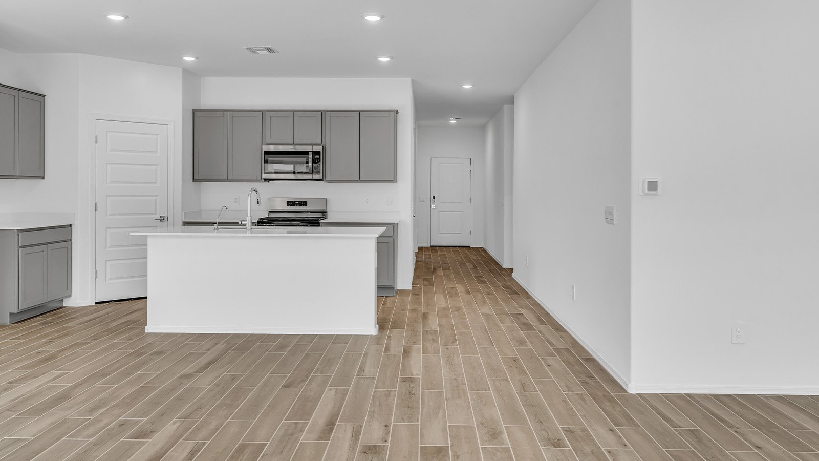 Discover the essence of Arizona living at Tortolita Trails, where The Cali plan offers an inviting blend of comfort and style. This 1,823 square foot single-story new home, located in the prestigious Dove Mountain area of Marana, Arizona, is designed to accommodate the needs of modern families. With four bedrooms and two bathrooms, The Cali provides ample space for relaxation, entertaining, and everything in between.  Step inside and be greeted by an open-concept layout that seamlessly connects the kitchen, dining room, and great room, creating a spacious environment perfect for gatherings. The kitchen, featuring a large pantry, modern appliances, and ample counter space, is a home chef's dream. The adjoining great room, with easy access to a covered patio, invites you to extend your living space outdoors, perfect for enjoying Arizona’s year-round sunshine.  The private primary suite is a true highlight, offering a spacious bedroom, a walk-in closet, and a bathroom complete with dual sinks and a large shower. Three additional bedrooms provide versatility for family members, guests, or a home office setup. A second bathroom, conveniently located near these bedrooms, ensures comfort for all.  In The Cali, you'll find a range of high-quality standard features that elevate your living experience. The home includes a modern kitchen with a large pantry, quartz countertops, stylish cabinetry, and energy-efficient appliances. The great room, designed for both comfort and functionality, connects seamlessly to the dining area and kitchen, creating an ideal space for entertaining. The covered patio offers an inviting outdoor retreat, perfect for enjoying Arizona's beautiful weather. Additionally, the home includes a two-car garage, providing ample storage and parking space.  Practicality meets style in The Cali, with thoughtful design elements like a utility room, abundant storage, and a two-car garage. Energy-efficient features throughout the home ensure that you can enjoy your space comfortably while keeping utility costs low.  Outside, Tortolita Trails offers a community atmosphere enriched with scenic views, recreational trails, and proximity to top-rated schools, shopping, and dining options. Whether you’re relaxing on the covered patio or exploring the surrounding natural beauty, The Cali at Tortolita Trails provides the perfect balance of modern living and outdoor adventure.