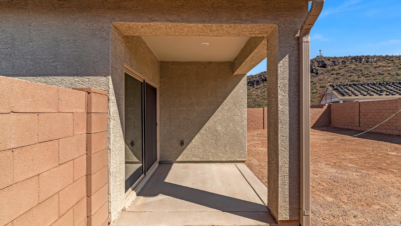 Discover the essence of Arizona living at Tortolita Trails, where The Cali plan offers an inviting blend of comfort and style. This 1,823 square foot single-story new home, located in the prestigious Dove Mountain area of Marana, Arizona, is designed to accommodate the needs of modern families. With four bedrooms and two bathrooms, The Cali provides ample space for relaxation, entertaining, and everything in between.  Step inside and be greeted by an open-concept layout that seamlessly connects the kitchen, dining room, and great room, creating a spacious environment perfect for gatherings. The kitchen, featuring a large pantry, modern appliances, and ample counter space, is a home chef's dream. The adjoining great room, with easy access to a covered patio, invites you to extend your living space outdoors, perfect for enjoying Arizona’s year-round sunshine.  The private primary suite is a true highlight, offering a spacious bedroom, a walk-in closet, and a bathroom complete with dual sinks and a large shower. Three additional bedrooms provide versatility for family members, guests, or a home office setup. A second bathroom, conveniently located near these bedrooms, ensures comfort for all.  In The Cali, you'll find a range of high-quality standard features that elevate your living experience. The home includes a modern kitchen with a large pantry, quartz countertops, stylish cabinetry, and energy-efficient appliances. The great room, designed for both comfort and functionality, connects seamlessly to the dining area and kitchen, creating an ideal space for entertaining. The covered patio offers an inviting outdoor retreat, perfect for enjoying Arizona's beautiful weather. Additionally, the home includes a two-car garage, providing ample storage and parking space.  Practicality meets style in The Cali, with thoughtful design elements like a utility room, abundant storage, and a two-car garage. Energy-efficient features throughout the home ensure that you can enjoy your space comfortably while keeping utility costs low.  Outside, Tortolita Trails offers a community atmosphere enriched with scenic views, recreational trails, and proximity to top-rated schools, shopping, and dining options. Whether you’re relaxing on the covered patio or exploring the surrounding natural beauty, The Cali at Tortolita Trails provides the perfect balance of modern living and outdoor adventure.