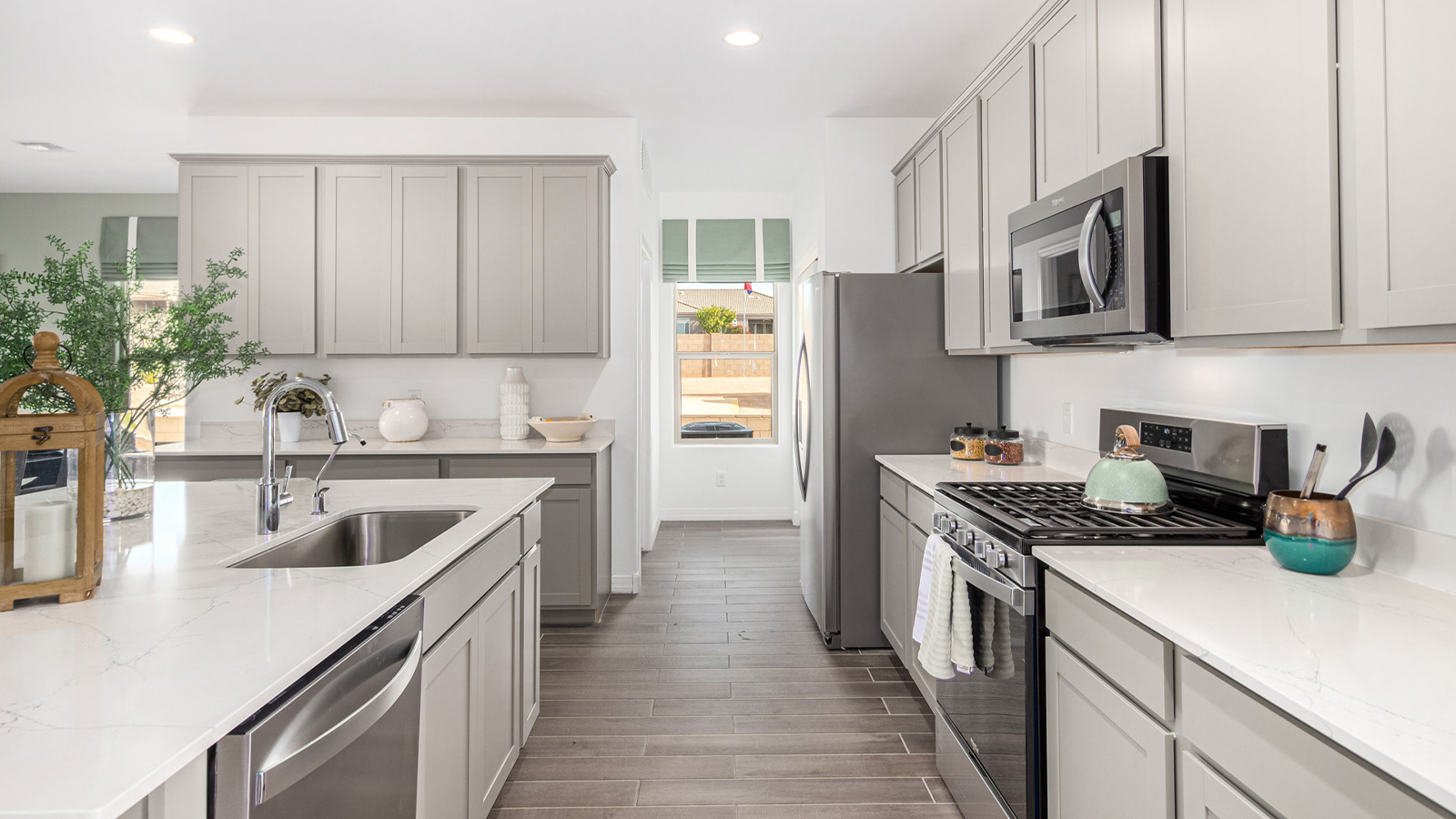 Introducing The Kingston, a spacious four-bedroom home settled within the peaceful community of Tortolita Trails in Marana, Arizona. With 2,051 square feet of living space, this single-story new home design offers both comfort and practicality for modern family life.