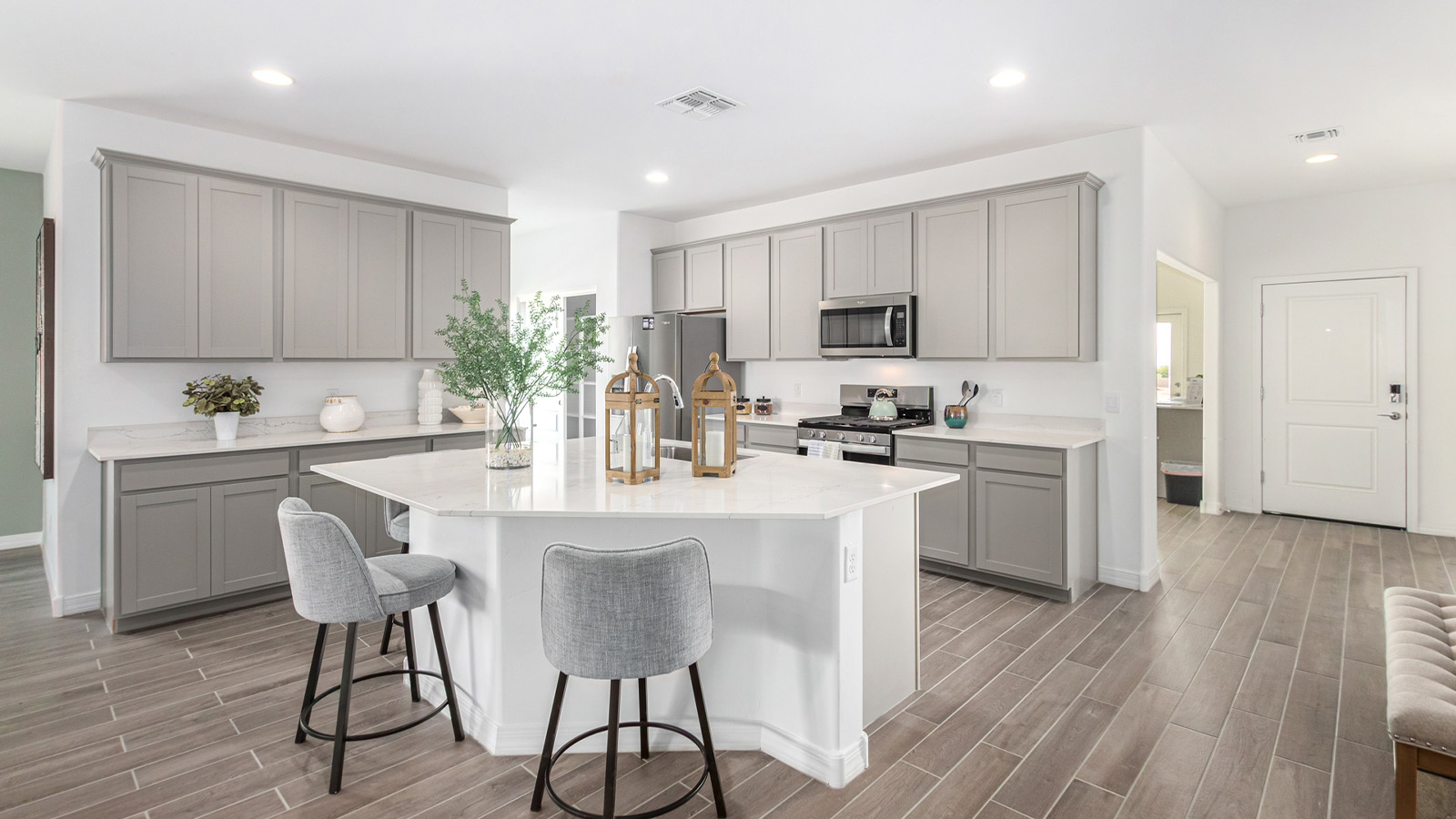 Introducing The Kingston, a spacious four-bedroom home settled within the peaceful community of Tortolita Trails in Marana, Arizona. With 2,051 square feet of living space, this single-story new home design offers both comfort and practicality for modern family life.