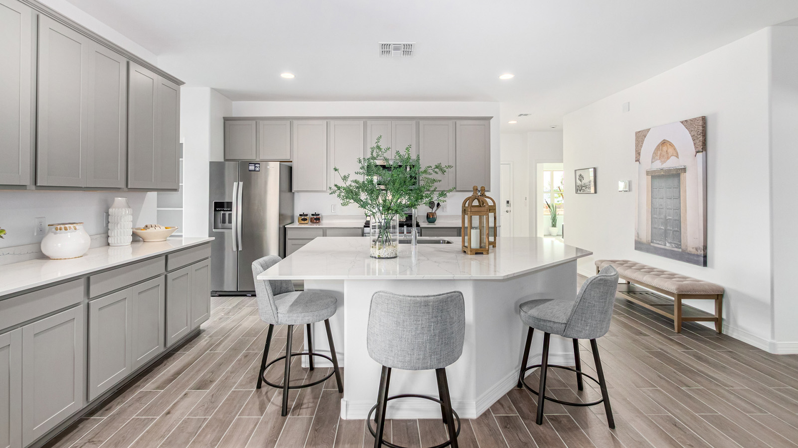 Introducing The Kingston, a spacious four-bedroom home settled within the peaceful community of Tortolita Trails in Marana, Arizona. With 2,051 square feet of living space, this single-story new home design offers both comfort and practicality for modern family life.