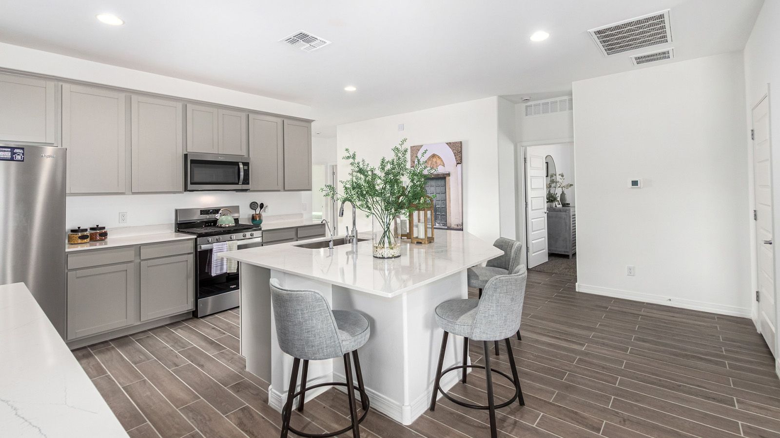 Introducing The Kingston, a spacious four-bedroom home settled within the peaceful community of Tortolita Trails in Marana, Arizona. With 2,051 square feet of living space, this single-story new home design offers both comfort and practicality for modern family life.