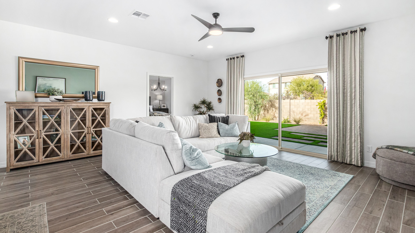 Introducing The Kingston, a spacious four-bedroom home settled within the peaceful community of Tortolita Trails in Marana, Arizona. With 2,051 square feet of living space, this single-story new home design offers both comfort and practicality for modern family life.