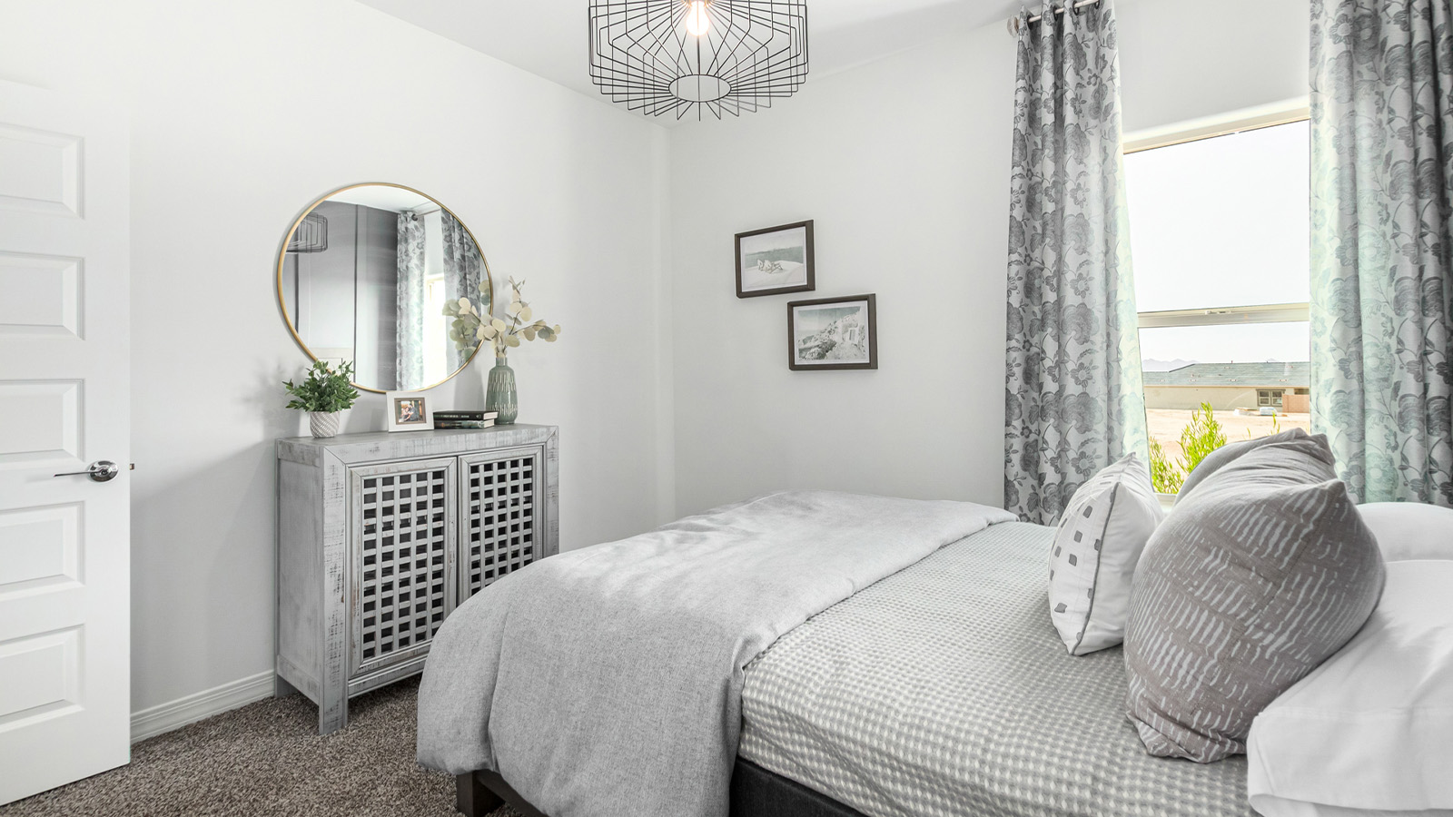 Introducing The Kingston, a spacious four-bedroom home settled within the peaceful community of Tortolita Trails in Marana, Arizona. With 2,051 square feet of living space, this single-story new home design offers both comfort and practicality for modern family life.