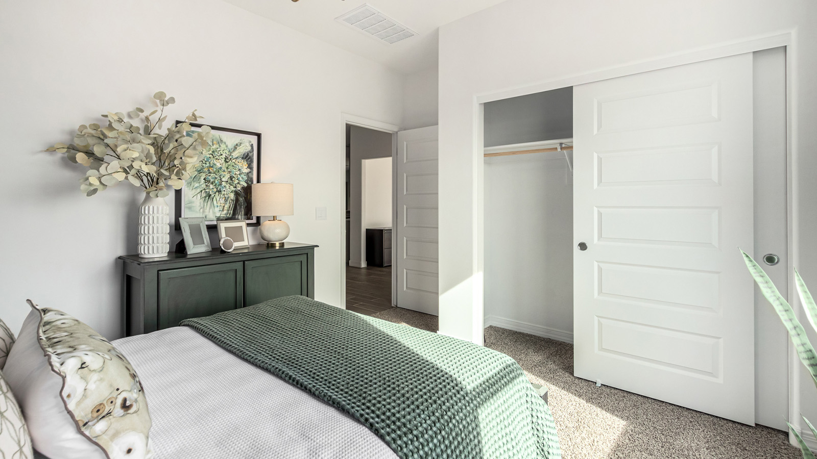 Introducing The Kingston, a spacious four-bedroom home settled within the peaceful community of Tortolita Trails in Marana, Arizona. With 2,051 square feet of living space, this single-story new home design offers both comfort and practicality for modern family life.