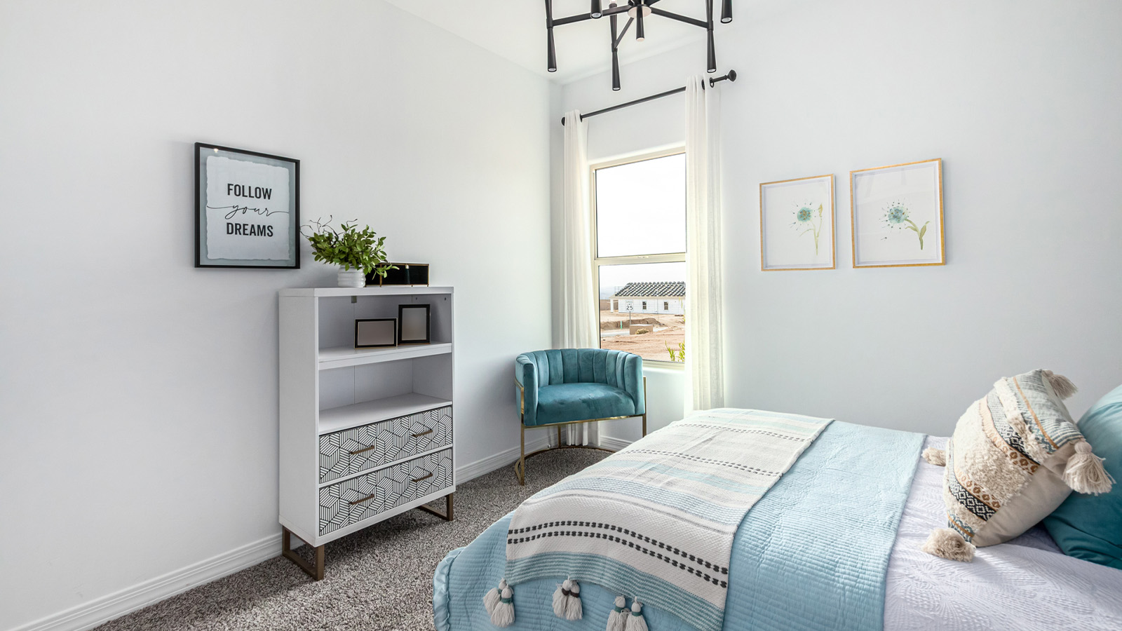 Introducing The Kingston, a spacious four-bedroom home settled within the peaceful community of Tortolita Trails in Marana, Arizona. With 2,051 square feet of living space, this single-story new home design offers both comfort and practicality for modern family life.