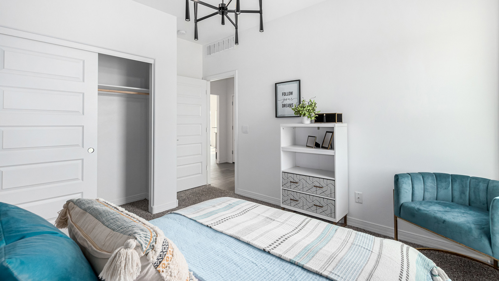 Introducing The Kingston, a spacious four-bedroom home settled within the peaceful community of Tortolita Trails in Marana, Arizona. With 2,051 square feet of living space, this single-story new home design offers both comfort and practicality for modern family life.