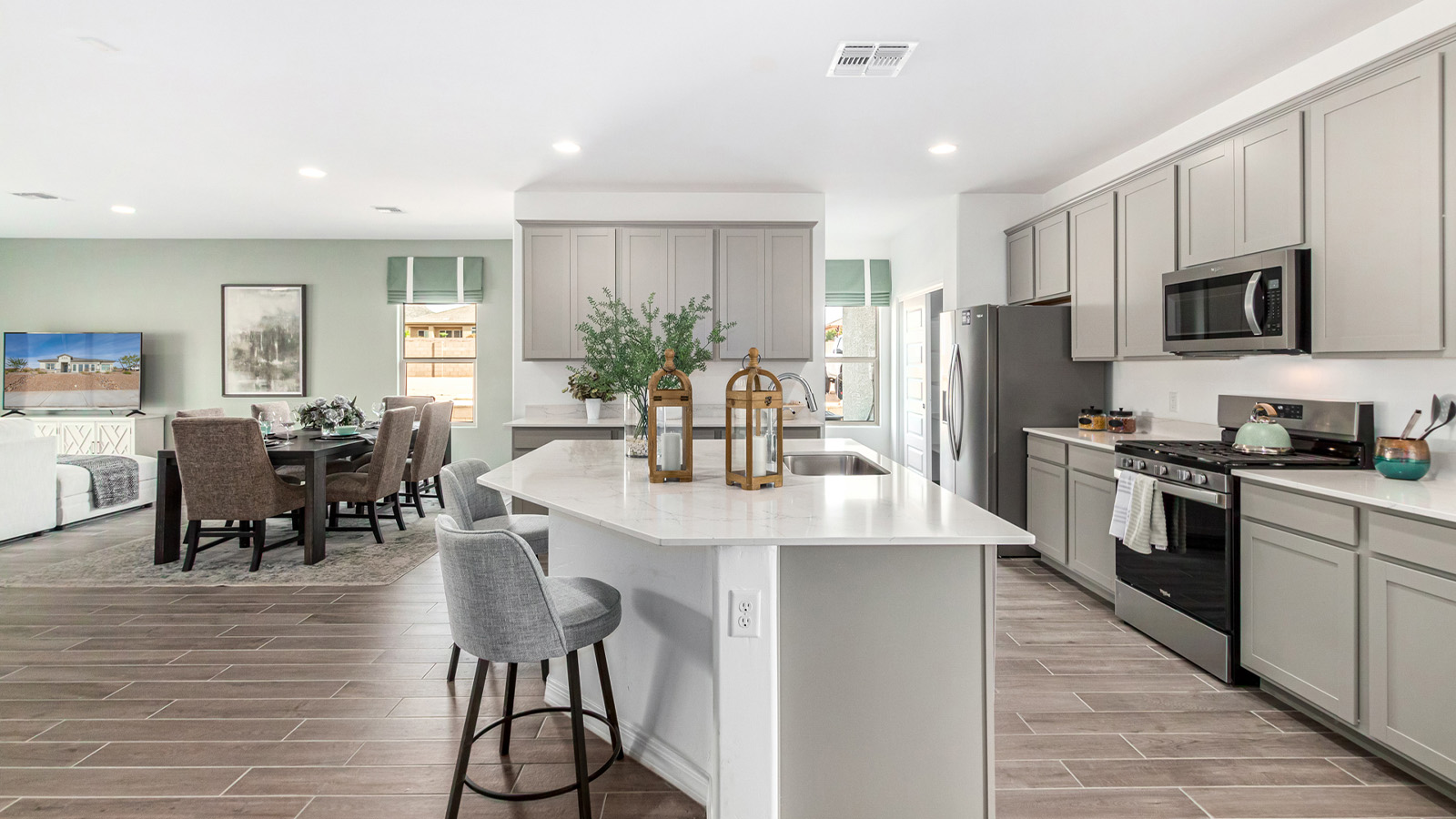 Introducing The Kingston, a spacious four-bedroom home settled within the peaceful community of Tortolita Trails in Marana, Arizona. With 2,051 square feet of living space, this single-story new home design offers both comfort and practicality for modern family life.  Upon entering, you're greeted by a welcoming foyer that flows into an open-concept layout, where each area of the home is thoughtfully arranged for easy living. The kitchen, complete with a large quartz countertop island and top-of-the-line appliances, is perfectly suited for both everyday meals and special gatherings. Adjacent to the kitchen, the great room invites relaxation and socializing, with direct access to a covered patio where you can unwind and appreciate the desert views.  The primary suite is a private retreat, featuring a generous walk-in closet and an en-suite bathroom with dual sinks and a walk-in shower. The three additional bedrooms are well-sized, providing ample space for family, guests, or a home office. A second bathroom and a convenient utility room add to the home's functionality.  Homes at Tortolita Trails are equipped with high-quality features, including quartz countertops, 42” shaker-style cabinets, and durable wood-look tile flooring. The community’s focus on energy efficiency is reflected in the inclusion of tankless water heaters, LED lighting, and advanced spray foam insulation, offering both comfort and cost savings.  The Kingston also includes a suite of smart home features, such as a video doorbell, keyless entry, a Wi-Fi-enabled garage door opener and more, all designed to make your daily life easier and more connected.  Living in Tortolita Trails means enjoying the perfect balance of privacy and community, with access to parks, playgrounds, and miles of scenic trails. The Kingston at Tortolita Trails offers a blend of modern conveniences and natural surroundings, making it the ideal place to call home.