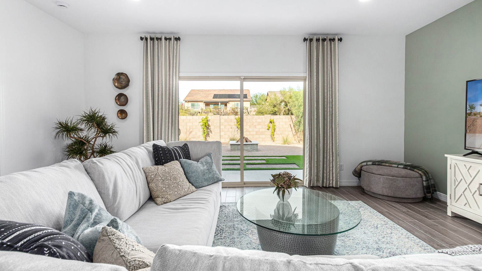 Introducing The Kingston, a spacious four-bedroom home settled within the peaceful community of Tortolita Trails in Marana, Arizona. With 2,051 square feet of living space, this single-story new home design offers both comfort and practicality for modern family life.  Upon entering, you're greeted by a welcoming foyer that flows into an open-concept layout, where each area of the home is thoughtfully arranged for easy living. The kitchen, complete with a large quartz countertop island and top-of-the-line appliances, is perfectly suited for both everyday meals and special gatherings. Adjacent to the kitchen, the great room invites relaxation and socializing, with direct access to a covered patio where you can unwind and appreciate the desert views.  The primary suite is a private retreat, featuring a generous walk-in closet and an en-suite bathroom with dual sinks and a walk-in shower. The three additional bedrooms are well-sized, providing ample space for family, guests, or a home office. A second bathroom and a convenient utility room add to the home's functionality.  Homes at Tortolita Trails are equipped with high-quality features, including quartz countertops, 42” shaker-style cabinets, and durable wood-look tile flooring. The community’s focus on energy efficiency is reflected in the inclusion of tankless water heaters, LED lighting, and advanced spray foam insulation, offering both comfort and cost savings.  The Kingston also includes a suite of smart home features, such as a video doorbell, keyless entry, a Wi-Fi-enabled garage door opener and more, all designed to make your daily life easier and more connected.  Living in Tortolita Trails means enjoying the perfect balance of privacy and community, with access to parks, playgrounds, and miles of scenic trails. The Kingston at Tortolita Trails offers a blend of modern conveniences and natural surroundings, making it the ideal place to call home.