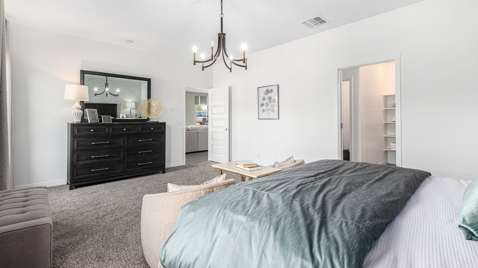 Introducing The Kingston, a spacious four-bedroom home settled within the peaceful community of Tortolita Trails in Marana, Arizona. With 2,051 square feet of living space, this single-story new home design offers both comfort and practicality for modern family life.  Upon entering, you're greeted by a welcoming foyer that flows into an open-concept layout, where each area of the home is thoughtfully arranged for easy living. The kitchen, complete with a large quartz countertop island and top-of-the-line appliances, is perfectly suited for both everyday meals and special gatherings. Adjacent to the kitchen, the great room invites relaxation and socializing, with direct access to a covered patio where you can unwind and appreciate the desert views.  The primary suite is a private retreat, featuring a generous walk-in closet and an en-suite bathroom with dual sinks and a walk-in shower. The three additional bedrooms are well-sized, providing ample space for family, guests, or a home office. A second bathroom and a convenient utility room add to the home's functionality.  Homes at Tortolita Trails are equipped with high-quality features, including quartz countertops, 42” shaker-style cabinets, and durable wood-look tile flooring. The community’s focus on energy efficiency is reflected in the inclusion of tankless water heaters, LED lighting, and advanced spray foam insulation, offering both comfort and cost savings.  The Kingston also includes a suite of smart home features, such as a video doorbell, keyless entry, a Wi-Fi-enabled garage door opener and more, all designed to make your daily life easier and more connected.  Living in Tortolita Trails means enjoying the perfect balance of privacy and community, with access to parks, playgrounds, and miles of scenic trails. The Kingston at Tortolita Trails offers a blend of modern conveniences and natural surroundings, making it the ideal place to call home.