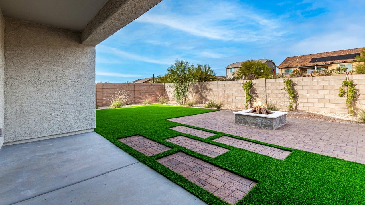 Introducing The Kingston, a spacious four-bedroom home settled within the peaceful community of Tortolita Trails in Marana, Arizona. With 2,051 square feet of living space, this single-story new home design offers both comfort and practicality for modern family life.  Upon entering, you're greeted by a welcoming foyer that flows into an open-concept layout, where each area of the home is thoughtfully arranged for easy living. The kitchen, complete with a large quartz countertop island and top-of-the-line appliances, is perfectly suited for both everyday meals and special gatherings. Adjacent to the kitchen, the great room invites relaxation and socializing, with direct access to a covered patio where you can unwind and appreciate the desert views.  The primary suite is a private retreat, featuring a generous walk-in closet and an en-suite bathroom with dual sinks and a walk-in shower. The three additional bedrooms are well-sized, providing ample space for family, guests, or a home office. A second bathroom and a convenient utility room add to the home's functionality.  Homes at Tortolita Trails are equipped with high-quality features, including quartz countertops, 42” shaker-style cabinets, and durable wood-look tile flooring. The community’s focus on energy efficiency is reflected in the inclusion of tankless water heaters, LED lighting, and advanced spray foam insulation, offering both comfort and cost savings.  The Kingston also includes a suite of smart home features, such as a video doorbell, keyless entry, a Wi-Fi-enabled garage door opener and more, all designed to make your daily life easier and more connected.  Living in Tortolita Trails means enjoying the perfect balance of privacy and community, with access to parks, playgrounds, and miles of scenic trails. The Kingston at Tortolita Trails offers a blend of modern conveniences and natural surroundings, making it the ideal place to call home.