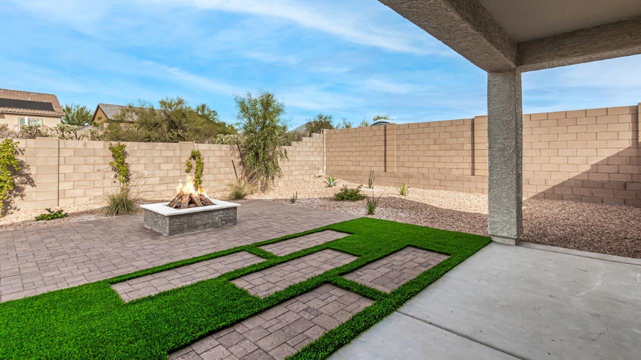 Introducing The Kingston, a spacious four-bedroom home settled within the peaceful community of Tortolita Trails in Marana, Arizona. With 2,051 square feet of living space, this single-story new home design offers both comfort and practicality for modern family life.  Upon entering, you're greeted by a welcoming foyer that flows into an open-concept layout, where each area of the home is thoughtfully arranged for easy living. The kitchen, complete with a large quartz countertop island and top-of-the-line appliances, is perfectly suited for both everyday meals and special gatherings. Adjacent to the kitchen, the great room invites relaxation and socializing, with direct access to a covered patio where you can unwind and appreciate the desert views.  The primary suite is a private retreat, featuring a generous walk-in closet and an en-suite bathroom with dual sinks and a walk-in shower. The three additional bedrooms are well-sized, providing ample space for family, guests, or a home office. A second bathroom and a convenient utility room add to the home's functionality.  Homes at Tortolita Trails are equipped with high-quality features, including quartz countertops, 42” shaker-style cabinets, and durable wood-look tile flooring. The community’s focus on energy efficiency is reflected in the inclusion of tankless water heaters, LED lighting, and advanced spray foam insulation, offering both comfort and cost savings.  The Kingston also includes a suite of smart home features, such as a video doorbell, keyless entry, a Wi-Fi-enabled garage door opener and more, all designed to make your daily life easier and more connected.  Living in Tortolita Trails means enjoying the perfect balance of privacy and community, with access to parks, playgrounds, and miles of scenic trails. The Kingston at Tortolita Trails offers a blend of modern conveniences and natural surroundings, making it the ideal place to call home.