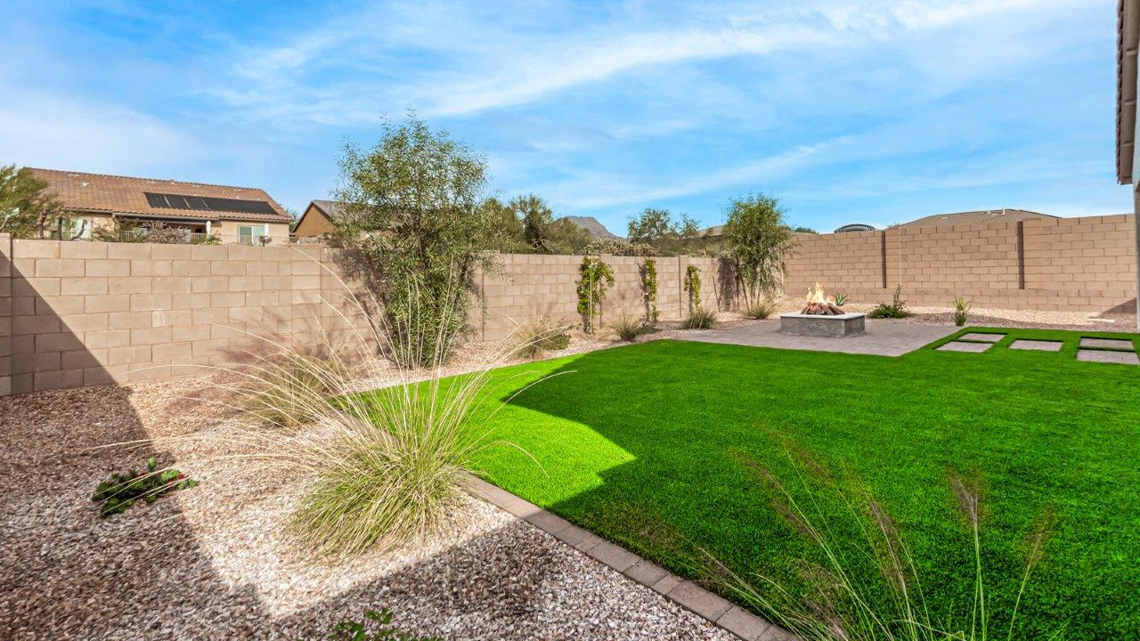 Introducing The Kingston, a spacious four-bedroom home settled within the peaceful community of Tortolita Trails in Marana, Arizona. With 2,051 square feet of living space, this single-story new home design offers both comfort and practicality for modern family life.  Upon entering, you're greeted by a welcoming foyer that flows into an open-concept layout, where each area of the home is thoughtfully arranged for easy living. The kitchen, complete with a large quartz countertop island and top-of-the-line appliances, is perfectly suited for both everyday meals and special gatherings. Adjacent to the kitchen, the great room invites relaxation and socializing, with direct access to a covered patio where you can unwind and appreciate the desert views.  The primary suite is a private retreat, featuring a generous walk-in closet and an en-suite bathroom with dual sinks and a walk-in shower. The three additional bedrooms are well-sized, providing ample space for family, guests, or a home office. A second bathroom and a convenient utility room add to the home's functionality.  Homes at Tortolita Trails are equipped with high-quality features, including quartz countertops, 42” shaker-style cabinets, and durable wood-look tile flooring. The community’s focus on energy efficiency is reflected in the inclusion of tankless water heaters, LED lighting, and advanced spray foam insulation, offering both comfort and cost savings.  The Kingston also includes a suite of smart home features, such as a video doorbell, keyless entry, a Wi-Fi-enabled garage door opener and more, all designed to make your daily life easier and more connected.  Living in Tortolita Trails means enjoying the perfect balance of privacy and community, with access to parks, playgrounds, and miles of scenic trails. The Kingston at Tortolita Trails offers a blend of modern conveniences and natural surroundings, making it the ideal place to call home.