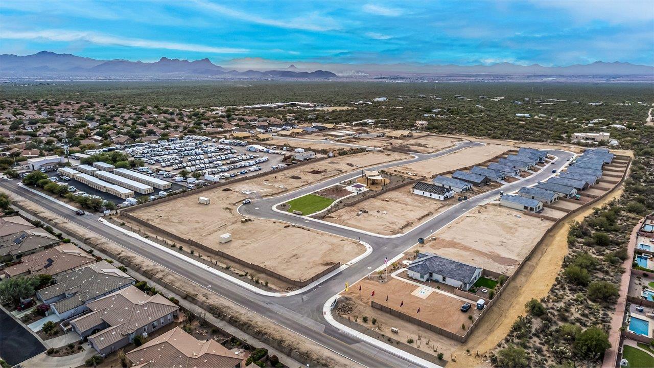 Welcome to The Frisco, a distinctive residence in Tortolita Trails, Marana, Arizona. This 2,094-square-foot new home is designed with modern living in mind, offering four bedrooms and two bathrooms in a layout that prioritizes both comfort and style.  As you step inside, you’ll be greeted by a spacious great room that flows naturally into the dining area and kitchen. This open-concept design is perfect for everyday living and hosting gatherings. The kitchen, featuring a large island and a generous pantry, provides plenty of space for cooking and storage, while the adjacent nook is ideal for casual meals.  The primary bedroom serves as a peaceful getaway, complete with a large walk-in closet and a private bathroom that includes dual sinks and a roomy shower. The additional three bedrooms offer flexibility and are well-sized, making them suitable for a home office, guest room, or playroom.  In addition to the thoughtfully designed interiors, The Frisco offers exterior features that enhance its appeal. The covered patio provides a perfect spot for outdoor dining or relaxing, while the front porch welcomes guests with a charming entrance. The two-car garage offers ample space for vehicles and storage, ensuring that both practicality and convenience are at the forefront of this home’s design.  This home includes a range of premium features such as quartz countertops, durable 42” cabinets, and elegant wood-style tile flooring throughout the main living areas. Built with energy efficiency in mind, it boasts energy-saving LED lighting, advanced insulation, and a modern kitchen sink equipped with a water filtration system and a soft water loop.  Located within the serene community of Tortolita Trails, The Frisco is surrounded by natural beauty and offers easy access to various outdoor activities, including hiking and biking trails. With close proximity to top-rated schools, shopping, dining, and entertainment, The Frisco provides an ideal blend of comfort, style, and convenience.
