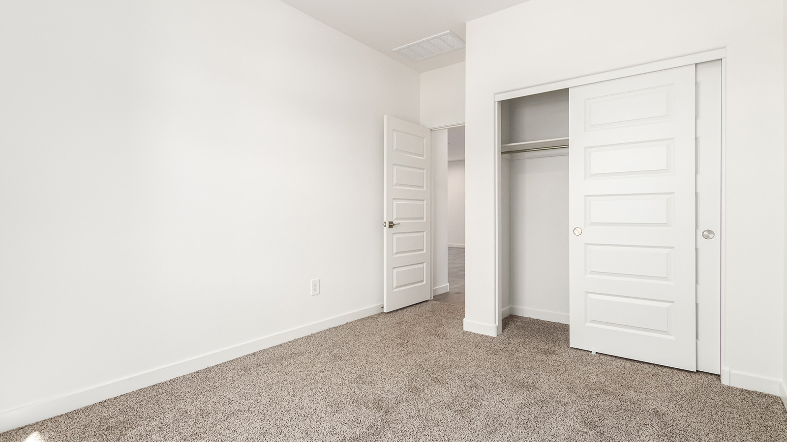 Snuggled within the serene surroundings of Sycamore Vista, The Baxter offers a blend of comfort and convenience, making it a perfect fit for modern living. Spanning 1,423 square feet, this thoughtfully crafted single-story home features three bedrooms, two bathrooms, and a flexible 2-3 car garage, all within the picturesque foothills of the Santa Rita Mountains.  As you step onto the welcoming front porch and enter through the foyer, you’re greeted by a spacious and open floor plan that flows effortlessly into the heart of the home. The great room is designed for both relaxation and socializing, seamlessly connecting to the dining area and kitchen. The kitchen is a culinary enthusiast's dream, featuring sleek granite countertops, a central island, and Shaker-style cabinetry, all designed to offer ample storage and a stylish backdrop for your cooking adventures. The adjacent pantry ensures that all your essentials are within easy reach, making meal prep both efficient and enjoyable.  The primary bedroom, located at the rear of the home for enhanced privacy, serves as a peaceful retreat. It includes a spacious walk-in closet and an en-suite bathroom equipped with dual vanities and a luxurious shower. The two additional bedrooms are thoughtfully positioned near the front of the home, sharing a full bathroom, making it ideal for families or guests.  Outdoor living is a key feature of The Baxter, with a covered patio that extends from the dining area, offering the perfect space to enjoy Tucson’s stunning sunsets or host a weekend barbecue. The 2-3 car garage provides ample space for vehicles, storage, or even a small workshop, catering to various needs.  Living in Sycamore Vista means you’re part of a community that values both convenience and quality of life. Each home in this community comes with beautifully landscaped front yards, equipped with auto drip irrigation systems and soft water loops, enhancing the beauty and functionality of your outdoor space. Additionally, Sycamore Vista homes are energy-efficient, featuring DOE Zero Energy Ready standards, including spray foam insulation, tankless water heaters, and LED lighting throughout, ensuring lower energy costs and a reduced environmental footprint.  The community’s higher elevation not only offers cooler summer temperatures but also less light pollution, making it a perfect spot for stargazing. Sycamore Vista is ideally located near top-rated schools in the Vail School District, including Sycamore Elementary and Corona Foothills Middle School, making it an ideal choice for families.  Beyond the tranquility of home, outdoor enthusiasts will appreciate the proximity to local state and national parks, including Coronado National Forest and Colossal Cave Mountain Park, offering endless opportunities for hiking, biking, and exploring Arizona’s natural beauty. The community’s location also provides easy access to shopping, dining, and major employers like the Target Distribution Center and the Amazon Fulfillment Center, ensuring that everything you need is within reach.  Experience the best of Arizona living at Sycamore Vista, where The Baxter offers the perfect blend of modern amenities, quality craftsmanship, and the natural beauty of the Santa Rita Mountains, creating a place you’ll be proud to call home.