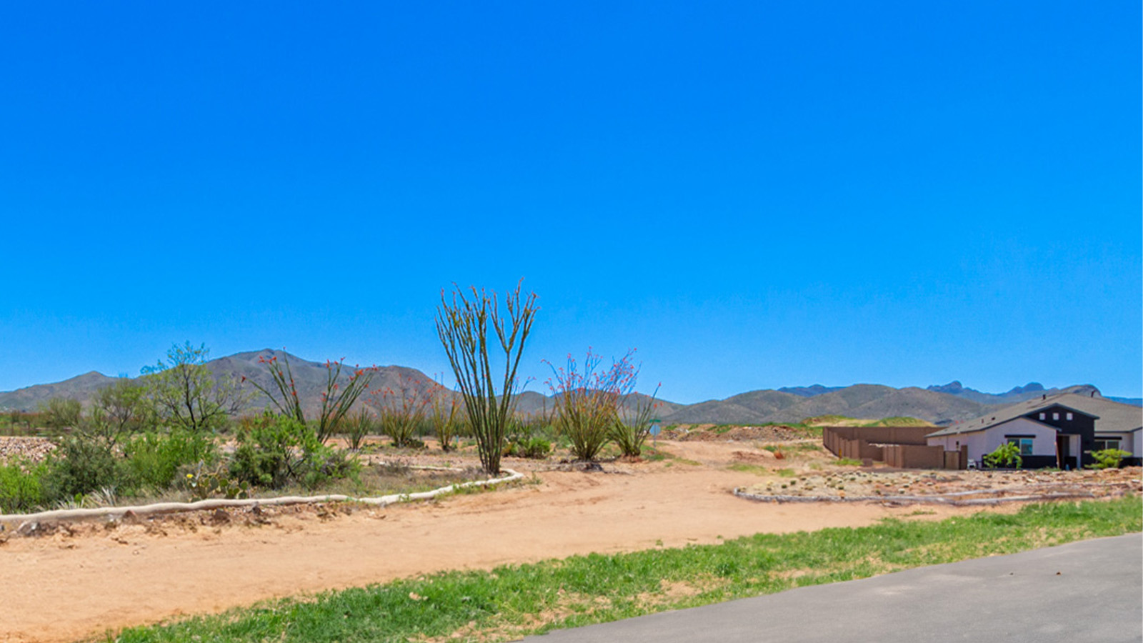 Snuggled within the serene surroundings of Sycamore Vista, The Baxter offers a blend of comfort and convenience, making it a perfect fit for modern living. Spanning 1,423 square feet, this thoughtfully crafted single-story home features three bedrooms, two bathrooms, and a flexible 2-3 car garage, all within the picturesque foothills of the Santa Rita Mountains.  As you step onto the welcoming front porch and enter through the foyer, you’re greeted by a spacious and open floor plan that flows effortlessly into the heart of the home. The great room is designed for both relaxation and socializing, seamlessly connecting to the dining area and kitchen. The kitchen is a culinary enthusiast's dream, featuring sleek granite countertops, a central island, and Shaker-style cabinetry, all designed to offer ample storage and a stylish backdrop for your cooking adventures. The adjacent pantry ensures that all your essentials are within easy reach, making meal prep both efficient and enjoyable.  The primary bedroom, located at the rear of the home for enhanced privacy, serves as a peaceful retreat. It includes a spacious walk-in closet and an en-suite bathroom equipped with dual vanities and a luxurious shower. The two additional bedrooms are thoughtfully positioned near the front of the home, sharing a full bathroom, making it ideal for families or guests.  Outdoor living is a key feature of The Baxter, with a covered patio that extends from the dining area, offering the perfect space to enjoy Tucson’s stunning sunsets or host a weekend barbecue. The 2-3 car garage provides ample space for vehicles, storage, or even a small workshop, catering to various needs.  Living in Sycamore Vista means you’re part of a community that values both convenience and quality of life. Each home in this community comes with beautifully landscaped front yards, equipped with auto drip irrigation systems and soft water loops, enhancing the beauty and functionality of your outdoor space. Additionally, Sycamore Vista homes are energy-efficient, featuring DOE Zero Energy Ready standards, including spray foam insulation, tankless water heaters, and LED lighting throughout, ensuring lower energy costs and a reduced environmental footprint.  The community’s higher elevation not only offers cooler summer temperatures but also less light pollution, making it a perfect spot for stargazing. Sycamore Vista is ideally located near top-rated schools in the Vail School District, including Sycamore Elementary and Corona Foothills Middle School, making it an ideal choice for families.  Beyond the tranquility of home, outdoor enthusiasts will appreciate the proximity to local state and national parks, including Coronado National Forest and Colossal Cave Mountain Park, offering endless opportunities for hiking, biking, and exploring Arizona’s natural beauty. The community’s location also provides easy access to shopping, dining, and major employers like the Target Distribution Center and the Amazon Fulfillment Center, ensuring that everything you need is within reach.  Experience the best of Arizona living at Sycamore Vista, where The Baxter offers the perfect blend of modern amenities, quality craftsmanship, and the natural beauty of the Santa Rita Mountains, creating a place you’ll be proud to call home.