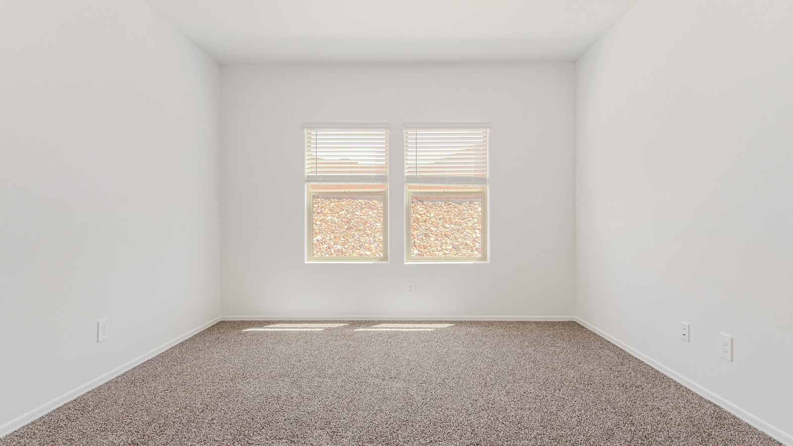 Step into The Elgin, a spacious single-story home located in the scenic Sycamore Vista community in Vail, AZ. This floor plan offers 1,635 square feet of well-planned living space, perfect for those who appreciate both comfort and functionality. With four bedrooms, two bathrooms, and a 3-car garage, The Elgin provides the ideal setting for modern living amidst the beauty of the Santa Rita Mountains.  As you enter through the inviting front porch, you’re welcomed by an open and airy floor plan that flows effortlessly from one room to the next. The heart of the home is the expansive great room, seamlessly connected to the dining area and kitchen, making it ideal for everyday living and entertaining. The kitchen is a chef’s delight, featuring a large island with a breakfast bar, granite countertops, and Shaker-style cabinetry, offering ample storage and workspace. The walk-in pantry and adjacent utility room add convenience and organization to your culinary adventures.  The primary suite is designed with relaxation in mind, offering a spacious bedroom with a walk-in closet and a private en-suite bathroom. This personal haven is positioned at the rear of the home for added privacy. The three additional bedrooms are located towards the front of the home, providing flexibility for guests, family, or a home office setup. A second full bathroom is conveniently situated near these bedrooms.  One of the standout features of The Elgin is the 3-car garage, providing plenty of room for vehicles, storage, or even a workshop. Whether you have multiple cars, recreational vehicles, or just need extra space, this garage has you covered.  Step outside to enjoy your covered patio, which is perfect for outdoor dining, lounging, or simply taking in the stunning Arizona sunsets. The large backyard provides endless possibilities for gardening, play, or creating your own outdoor oasis.  Living at Sycamore Vista means enjoying a community that balances modern amenities with natural beauty. Your home includes luxury finishes such as staggered wood-look ceramic tile flooring throughout most areas, granite countertops, and energy-efficient features like spray foam insulation and tankless water heaters. Additionally, each home in the community comes equipped with a Home is Connected® Smart Home package, offering conveniences like a smart thermostat, video doorbell, keyless entry, a wifi-enabled garage door opener and more.  Sycamore Vista’s prime location in the Vail School District makes it a great choice for families. With schools like Sycamore Elementary and Corona Foothills Middle School nearby, you’ll have peace of mind knowing your children are receiving a quality education. The community’s higher elevation offers cooler summer temperatures and spectacular night skies, making it a perfect spot for stargazing.  Experience the perfect blend of rural charm and modern convenience at Sycamore Vista, where The Elgin offers a space that’s more than just a house—it’s a home designed to grow with you and your family.