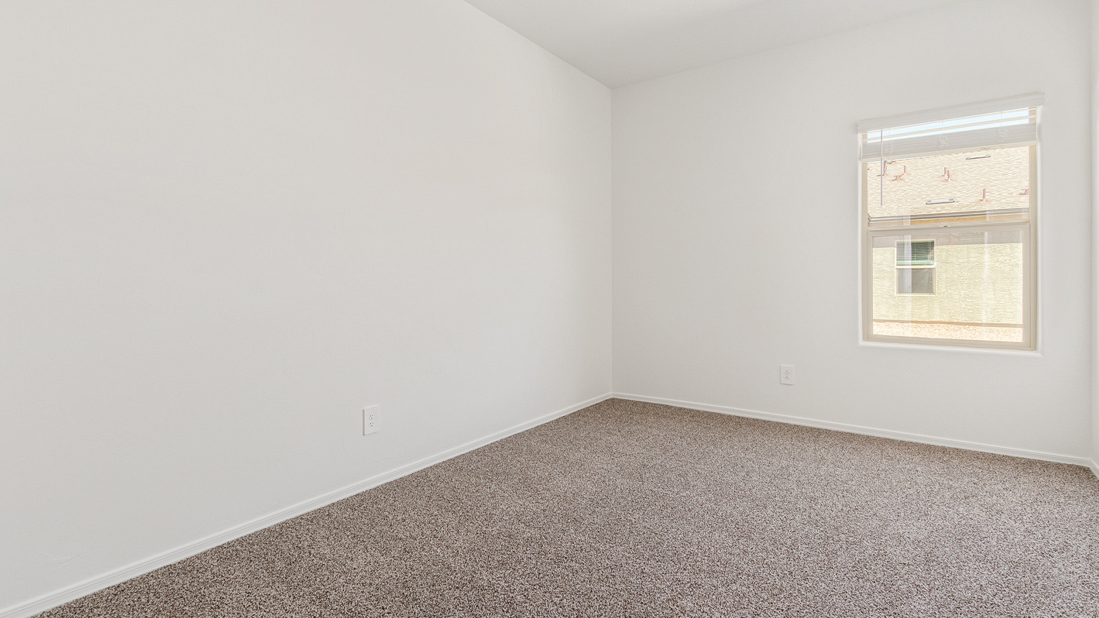 Step into The Elgin, a spacious single-story home located in the scenic Sycamore Vista community in Vail, AZ. This floor plan offers 1,635 square feet of well-planned living space, perfect for those who appreciate both comfort and functionality. With four bedrooms, two bathrooms, and a 3-car garage, The Elgin provides the ideal setting for modern living amidst the beauty of the Santa Rita Mountains.  As you enter through the inviting front porch, you’re welcomed by an open and airy floor plan that flows effortlessly from one room to the next. The heart of the home is the expansive great room, seamlessly connected to the dining area and kitchen, making it ideal for everyday living and entertaining. The kitchen is a chef’s delight, featuring a large island with a breakfast bar, granite countertops, and Shaker-style cabinetry, offering ample storage and workspace. The walk-in pantry and adjacent utility room add convenience and organization to your culinary adventures.  The primary suite is designed with relaxation in mind, offering a spacious bedroom with a walk-in closet and a private en-suite bathroom. This personal haven is positioned at the rear of the home for added privacy. The three additional bedrooms are located towards the front of the home, providing flexibility for guests, family, or a home office setup. A second full bathroom is conveniently situated near these bedrooms.  One of the standout features of The Elgin is the 3-car garage, providing plenty of room for vehicles, storage, or even a workshop. Whether you have multiple cars, recreational vehicles, or just need extra space, this garage has you covered.  Step outside to enjoy your covered patio, which is perfect for outdoor dining, lounging, or simply taking in the stunning Arizona sunsets. The large backyard provides endless possibilities for gardening, play, or creating your own outdoor oasis.  Living at Sycamore Vista means enjoying a community that balances modern amenities with natural beauty. Your home includes luxury finishes such as staggered wood-look ceramic tile flooring throughout most areas, granite countertops, and energy-efficient features like spray foam insulation and tankless water heaters. Additionally, each home in the community comes equipped with a Home is Connected® Smart Home package, offering conveniences like a smart thermostat, video doorbell, keyless entry, a wifi-enabled garage door opener and more.  Sycamore Vista’s prime location in the Vail School District makes it a great choice for families. With schools like Sycamore Elementary and Corona Foothills Middle School nearby, you’ll have peace of mind knowing your children are receiving a quality education. The community’s higher elevation offers cooler summer temperatures and spectacular night skies, making it a perfect spot for stargazing.  Experience the perfect blend of rural charm and modern convenience at Sycamore Vista, where The Elgin offers a space that’s more than just a house—it’s a home designed to grow with you and your family.