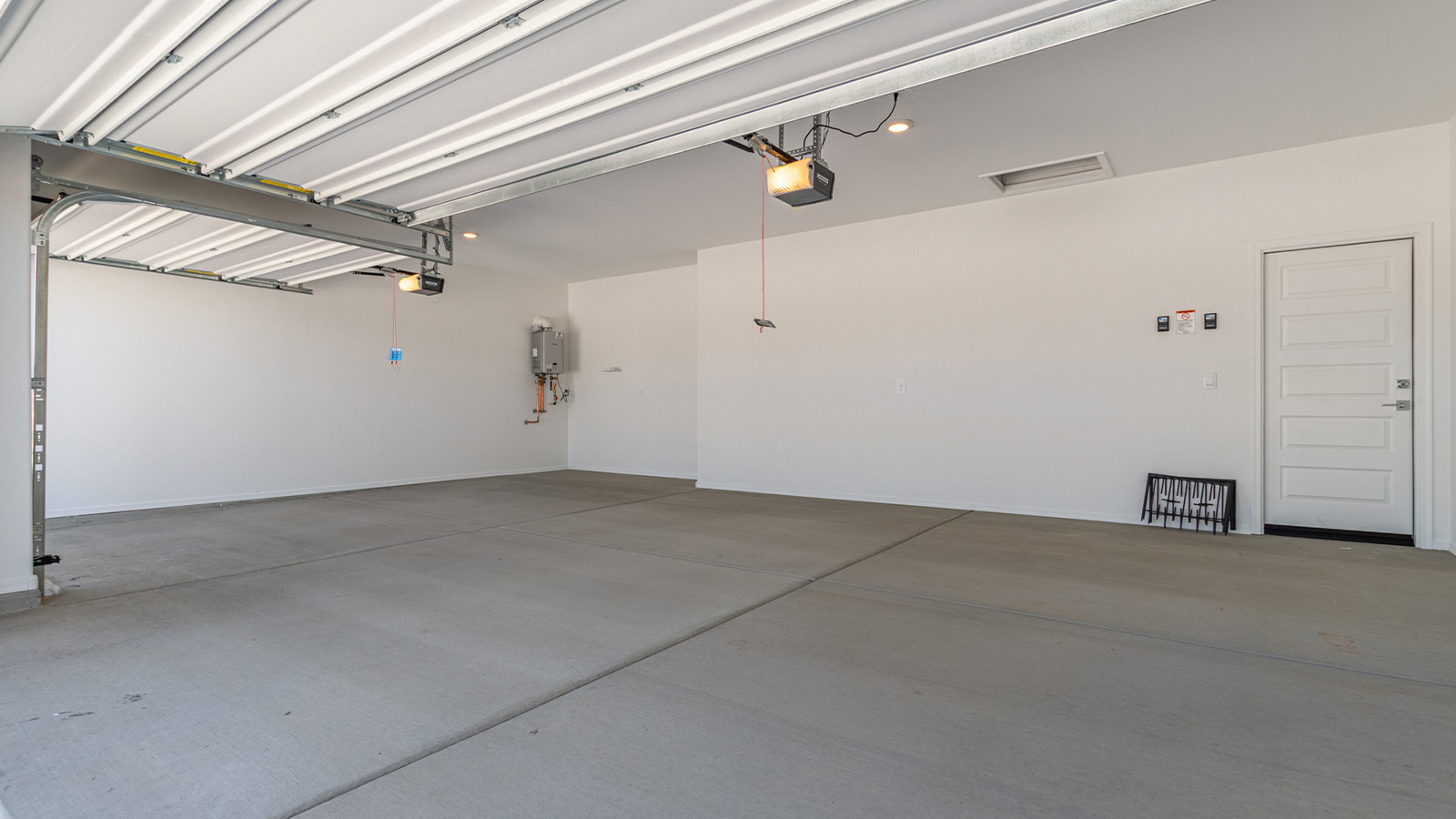 Step into The Elgin, a spacious single-story home located in the scenic Sycamore Vista community in Vail, AZ. This floor plan offers 1,635 square feet of well-planned living space, perfect for those who appreciate both comfort and functionality. With four bedrooms, two bathrooms, and a 3-car garage, The Elgin provides the ideal setting for modern living amidst the beauty of the Santa Rita Mountains.  As you enter through the inviting front porch, you’re welcomed by an open and airy floor plan that flows effortlessly from one room to the next. The heart of the home is the expansive great room, seamlessly connected to the dining area and kitchen, making it ideal for everyday living and entertaining. The kitchen is a chef’s delight, featuring a large island with a breakfast bar, granite countertops, and Shaker-style cabinetry, offering ample storage and workspace. The walk-in pantry and adjacent utility room add convenience and organization to your culinary adventures.  The primary suite is designed with relaxation in mind, offering a spacious bedroom with a walk-in closet and a private en-suite bathroom. This personal haven is positioned at the rear of the home for added privacy. The three additional bedrooms are located towards the front of the home, providing flexibility for guests, family, or a home office setup. A second full bathroom is conveniently situated near these bedrooms.  One of the standout features of The Elgin is the 3-car garage, providing plenty of room for vehicles, storage, or even a workshop. Whether you have multiple cars, recreational vehicles, or just need extra space, this garage has you covered.  Step outside to enjoy your covered patio, which is perfect for outdoor dining, lounging, or simply taking in the stunning Arizona sunsets. The large backyard provides endless possibilities for gardening, play, or creating your own outdoor oasis.  Living at Sycamore Vista means enjoying a community that balances modern amenities with natural beauty. Your home includes luxury finishes such as staggered wood-look ceramic tile flooring throughout most areas, granite countertops, and energy-efficient features like spray foam insulation and tankless water heaters. Additionally, each home in the community comes equipped with a Home is Connected® Smart Home package, offering conveniences like a smart thermostat, video doorbell, keyless entry, a wifi-enabled garage door opener and more.  Sycamore Vista’s prime location in the Vail School District makes it a great choice for families. With schools like Sycamore Elementary and Corona Foothills Middle School nearby, you’ll have peace of mind knowing your children are receiving a quality education. The community’s higher elevation offers cooler summer temperatures and spectacular night skies, making it a perfect spot for stargazing.  Experience the perfect blend of rural charm and modern convenience at Sycamore Vista, where The Elgin offers a space that’s more than just a house—it’s a home designed to grow with you and your family.