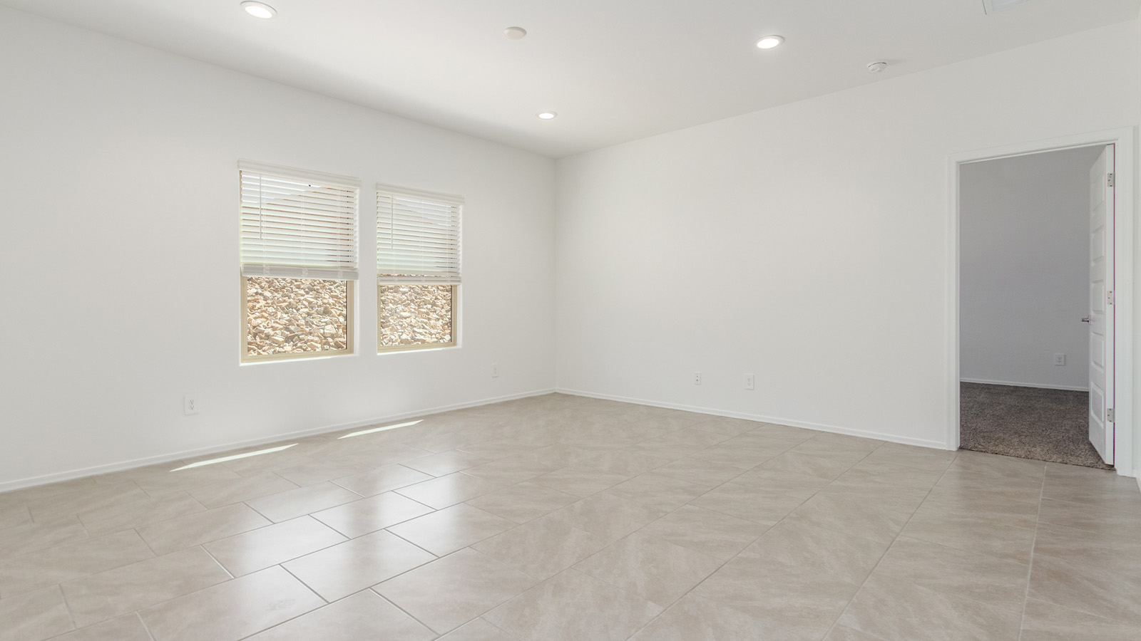 Experience the charm of The Cali, located within the peaceful Sycamore Vista community in the serene foothills of the Santa Rita Mountains, Arizona. This thoughtfully laid-out, single-story home offers 1,823 square feet of versatile living space designed to meet the needs of modern families.  Step into the inviting entryway, where you're welcomed by a spacious great room that serves as the heart of the home. The open-concept design connects the great room to the dining area and kitchen, creating a harmonious flow that's perfect for both entertaining and daily living. The kitchen is a true culinary haven, featuring a large island, granite countertops, and ample storage space with a walk-in pantry.  The Cali's four bedrooms are designed with relaxation in mind. The primary suite, tucked away from the other bedrooms, offers a private oasis complete with a walk-in closet and a well-appointed bathroom featuring dual vanities. The additional three bedrooms share a well-equipped bathroom and are situated to provide comfort and privacy for family members or guests.  Adding to the home's appeal are the premium standard features that come included in every Cali at Sycamore Vista. Enjoy the elegance of staggered wood-look ceramic tile flooring throughout the main living areas, complemented by Shaker-style cabinetry in the kitchen and bathrooms. The kitchen is further enhanced by an open single basin stainless steel sink paired with a water filtration system, making both cooking and cleanup a breeze. The energy-efficient design includes spray foam insulation, a tankless water heater, and LED lighting throughout, all contributing to lower utility costs and a more sustainable lifestyle.  Outdoor living is a breeze with the covered patio, easily accessible from the dining room, providing the perfect spot for morning coffee or evening gatherings. The three-car garage offers plenty of space for vehicles and storage, ensuring that everything you need is within easy reach.  Sycamore Vista's location offers a unique blend of tranquility and convenience, making The Cali an ideal choice for those seeking a peaceful retreat with easy access to modern amenities. Whether you're relaxing indoors or enjoying the outdoor beauty of Arizona, The Cali is a home that combines style, comfort, and functionality in every detail.