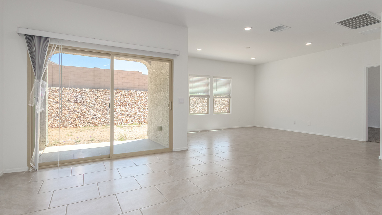 Experience the charm of The Cali, located within the peaceful Sycamore Vista community in the serene foothills of the Santa Rita Mountains, Arizona. This thoughtfully laid-out, single-story home offers 1,823 square feet of versatile living space designed to meet the needs of modern families.  Step into the inviting entryway, where you're welcomed by a spacious great room that serves as the heart of the home. The open-concept design connects the great room to the dining area and kitchen, creating a harmonious flow that's perfect for both entertaining and daily living. The kitchen is a true culinary haven, featuring a large island, granite countertops, and ample storage space with a walk-in pantry.  The Cali's four bedrooms are designed with relaxation in mind. The primary suite, tucked away from the other bedrooms, offers a private oasis complete with a walk-in closet and a well-appointed bathroom featuring dual vanities. The additional three bedrooms share a well-equipped bathroom and are situated to provide comfort and privacy for family members or guests.  Adding to the home's appeal are the premium standard features that come included in every Cali at Sycamore Vista. Enjoy the elegance of staggered wood-look ceramic tile flooring throughout the main living areas, complemented by Shaker-style cabinetry in the kitchen and bathrooms. The kitchen is further enhanced by an open single basin stainless steel sink paired with a water filtration system, making both cooking and cleanup a breeze. The energy-efficient design includes spray foam insulation, a tankless water heater, and LED lighting throughout, all contributing to lower utility costs and a more sustainable lifestyle.  Outdoor living is a breeze with the covered patio, easily accessible from the dining room, providing the perfect spot for morning coffee or evening gatherings. The three-car garage offers plenty of space for vehicles and storage, ensuring that everything you need is within easy reach.  Sycamore Vista's location offers a unique blend of tranquility and convenience, making The Cali an ideal choice for those seeking a peaceful retreat with easy access to modern amenities. Whether you're relaxing indoors or enjoying the outdoor beauty of Arizona, The Cali is a home that combines style, comfort, and functionality in every detail.