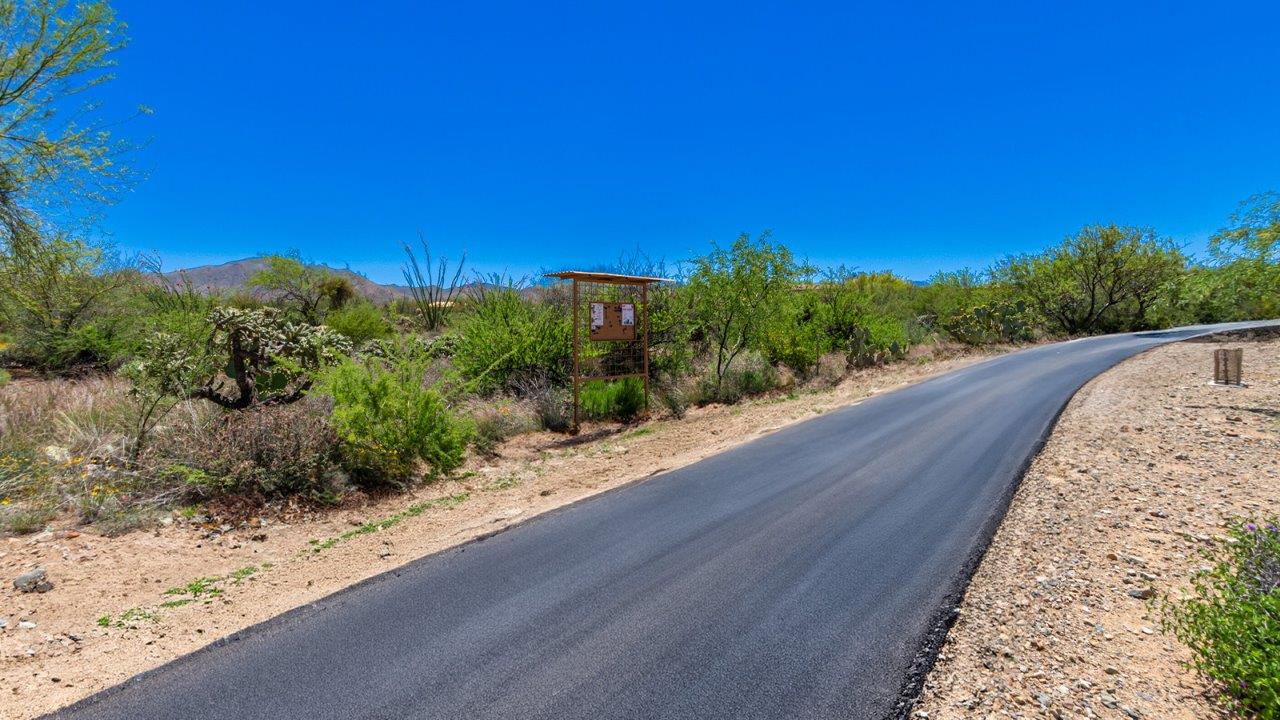 Experience the charm of The Cali, located within the peaceful Sycamore Vista community in the serene foothills of the Santa Rita Mountains, Arizona. This thoughtfully laid-out, single-story home offers 1,823 square feet of versatile living space designed to meet the needs of modern families.  Step into the inviting entryway, where you're welcomed by a spacious great room that serves as the heart of the home. The open-concept design connects the great room to the dining area and kitchen, creating a harmonious flow that's perfect for both entertaining and daily living. The kitchen is a true culinary haven, featuring a large island, granite countertops, and ample storage space with a walk-in pantry.  The Cali's four bedrooms are designed with relaxation in mind. The primary suite, tucked away from the other bedrooms, offers a private oasis complete with a walk-in closet and a well-appointed bathroom featuring dual vanities. The additional three bedrooms share a well-equipped bathroom and are situated to provide comfort and privacy for family members or guests.  Adding to the home's appeal are the premium standard features that come included in every Cali at Sycamore Vista. Enjoy the elegance of staggered wood-look ceramic tile flooring throughout the main living areas, complemented by Shaker-style cabinetry in the kitchen and bathrooms. The kitchen is further enhanced by an open single basin stainless steel sink paired with a water filtration system, making both cooking and cleanup a breeze. The energy-efficient design includes spray foam insulation, a tankless water heater, and LED lighting throughout, all contributing to lower utility costs and a more sustainable lifestyle.  Outdoor living is a breeze with the covered patio, easily accessible from the dining room, providing the perfect spot for morning coffee or evening gatherings. The three-car garage offers plenty of space for vehicles and storage, ensuring that everything you need is within easy reach.  Sycamore Vista's location offers a unique blend of tranquility and convenience, making The Cali an ideal choice for those seeking a peaceful retreat with easy access to modern amenities. Whether you're relaxing indoors or enjoying the outdoor beauty of Arizona, The Cali is a home that combines style, comfort, and functionality in every detail.