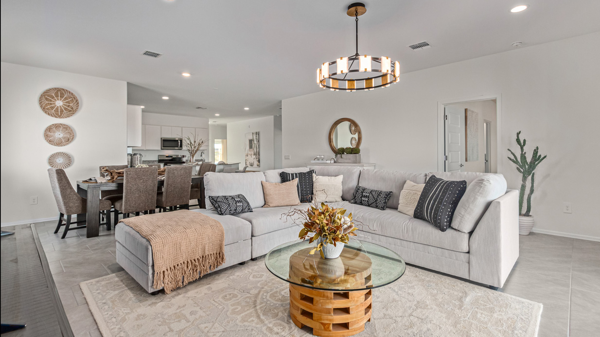 Welcome to the Kingston, a premier new home design situated in the picturesque Sycamore Vista community in Vail, Arizona. With an expansive 2,051 square feet of living space, this single-story home offers four bedrooms, two bathrooms, and a two-three car garage.  As you step inside, you are greeted by an inviting entryway that flows seamlessly into a heart of the home. The open-concept kitchen, equipped with a center island, modern appliances, and ample pantry space, makes it ideal for culinary adventures. Adjacent to the kitchen, the dining room offers easy access to the covered patio, where you can enjoy outdoor dining or simply relax in the tranquility of your private backyard.  The Kingston’s thoughtful layout ensures that every bedroom offers comfort and privacy. The primary suite, located at the rear of the home, features a large walk-in closet and an en-suite bathroom. The additional bedrooms are thoughtfully arranged to provide flexibility, whether you need a guest room, home office, or space for hobbies.  The Kingston is built with a focus on energy efficiency, featuring top-of-the-line insulation, energy-efficient appliances, and a smart home package that includes an automated thermostat, keyless entry, a Wi-Fi-enabled garage door opener, and more. This modern home not only offers comfort but also provides peace of mind with its energy-saving features and enhanced security systems.  Residents of Sycamore Vista enjoy a harmonious blend of rural tranquility and convenient urban access. With proximity to outdoor attractions like Coronado National Forest and Colossal Cave Mountain Park, as well as nearby schools and major employers, Sycamore Vista provides a unique living experience where nature and modern living coexist.  The Kingston at Sycamore Vista is more than just a house—it's a place to create lasting memories and live your best life.  *Images shown are for reference only. They depict the sales model home and may not represent the actual home.