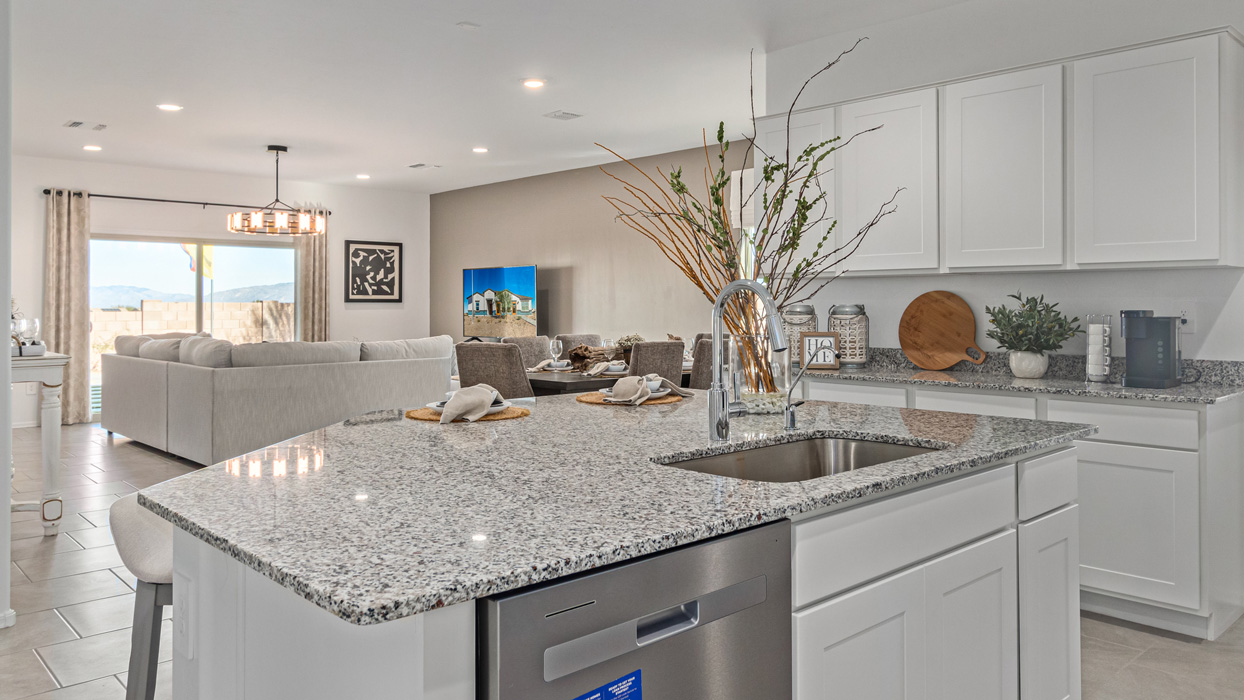 Welcome to the Kingston, a premier new home design situated in the picturesque Sycamore Vista community in Vail, Arizona. With an expansive 2,051 square feet of living space, this single-story home offers four bedrooms, two bathrooms, and a two-three car garage.  As you step inside, you are greeted by an inviting entryway that flows seamlessly into a heart of the home. The open-concept kitchen, equipped with a center island, modern appliances, and ample pantry space, makes it ideal for culinary adventures. Adjacent to the kitchen, the dining room offers easy access to the covered patio, where you can enjoy outdoor dining or simply relax in the tranquility of your private backyard.  The Kingston’s thoughtful layout ensures that every bedroom offers comfort and privacy. The primary suite, located at the rear of the home, features a large walk-in closet and an en-suite bathroom. The additional bedrooms are thoughtfully arranged to provide flexibility, whether you need a guest room, home office, or space for hobbies.  The Kingston is built with a focus on energy efficiency, featuring top-of-the-line insulation, energy-efficient appliances, and a smart home package that includes an automated thermostat, keyless entry, a Wi-Fi-enabled garage door opener, and more. This modern home not only offers comfort but also provides peace of mind with its energy-saving features and enhanced security systems.  Residents of Sycamore Vista enjoy a harmonious blend of rural tranquility and convenient urban access. With proximity to outdoor attractions like Coronado National Forest and Colossal Cave Mountain Park, as well as nearby schools and major employers, Sycamore Vista provides a unique living experience where nature and modern living coexist.  The Kingston at Sycamore Vista is more than just a house—it's a place to create lasting memories and live your best life.  *Images shown are for reference only. They depict the sales model home and may not represent the actual home.