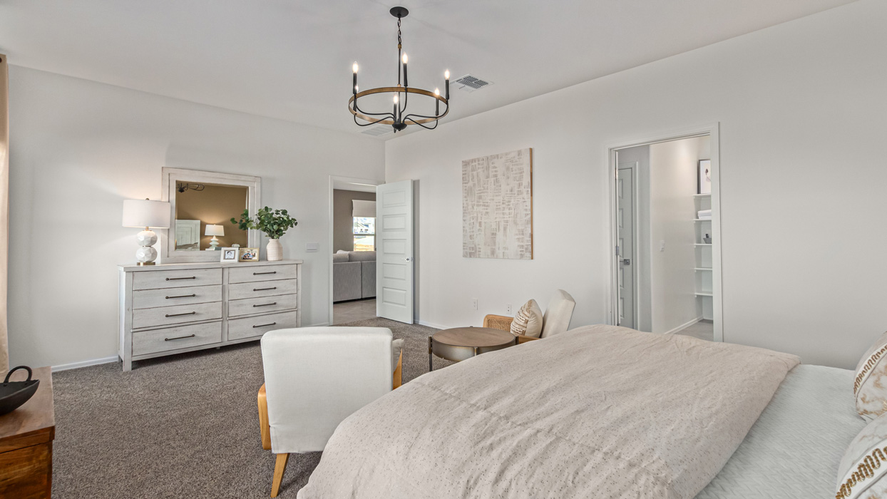 Welcome to the Kingston, a premier new home design situated in the picturesque Sycamore Vista community in Vail, Arizona. With an expansive 2,051 square feet of living space, this single-story home offers four bedrooms, two bathrooms, and a two-three car garage.  As you step inside, you are greeted by an inviting entryway that flows seamlessly into a heart of the home. The open-concept kitchen, equipped with a center island, modern appliances, and ample pantry space, makes it ideal for culinary adventures. Adjacent to the kitchen, the dining room offers easy access to the covered patio, where you can enjoy outdoor dining or simply relax in the tranquility of your private backyard.  The Kingston’s thoughtful layout ensures that every bedroom offers comfort and privacy. The primary suite, located at the rear of the home, features a large walk-in closet and an en-suite bathroom. The additional bedrooms are thoughtfully arranged to provide flexibility, whether you need a guest room, home office, or space for hobbies.  The Kingston is built with a focus on energy efficiency, featuring top-of-the-line insulation, energy-efficient appliances, and a smart home package that includes an automated thermostat, keyless entry, a Wi-Fi-enabled garage door opener, and more. This modern home not only offers comfort but also provides peace of mind with its energy-saving features and enhanced security systems.  Residents of Sycamore Vista enjoy a harmonious blend of rural tranquility and convenient urban access. With proximity to outdoor attractions like Coronado National Forest and Colossal Cave Mountain Park, as well as nearby schools and major employers, Sycamore Vista provides a unique living experience where nature and modern living coexist.  The Kingston at Sycamore Vista is more than just a house—it's a place to create lasting memories and live your best life.  *Images shown are for reference only. They depict the sales model home and may not represent the actual home.