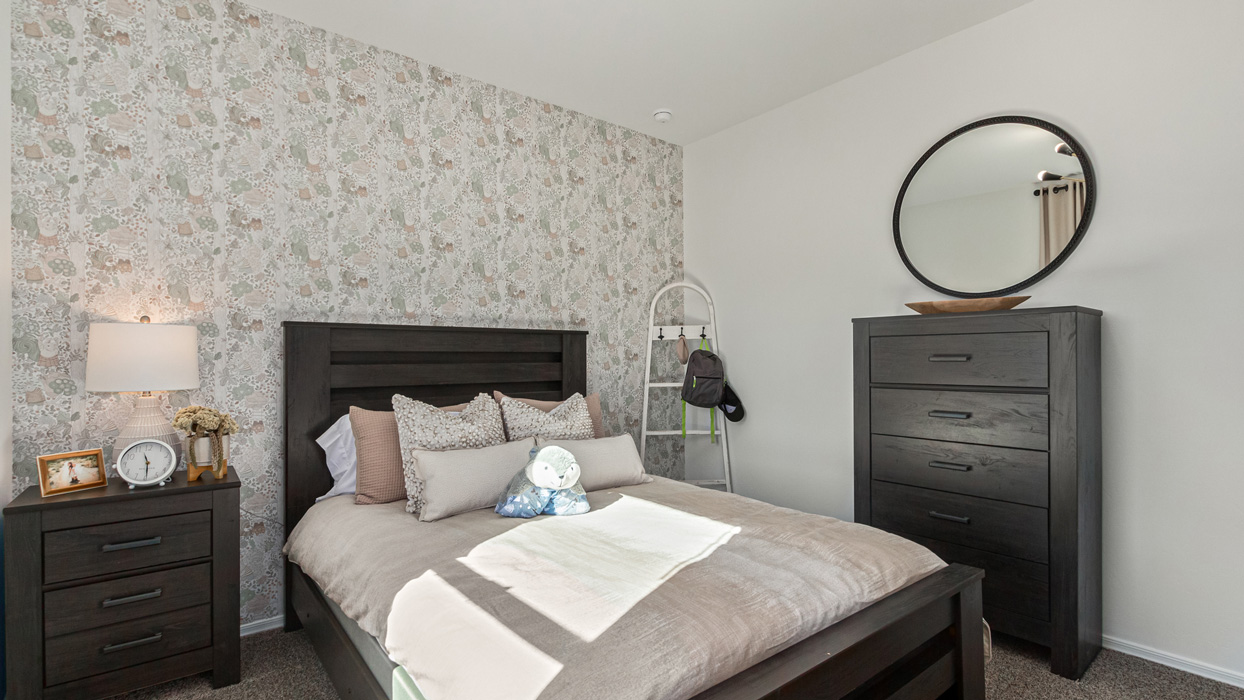 Welcome to the Kingston, a premier new home design situated in the picturesque Sycamore Vista community in Vail, Arizona. With an expansive 2,051 square feet of living space, this single-story home offers four bedrooms, two bathrooms, and a two-three car garage.  As you step inside, you are greeted by an inviting entryway that flows seamlessly into a heart of the home. The open-concept kitchen, equipped with a center island, modern appliances, and ample pantry space, makes it ideal for culinary adventures. Adjacent to the kitchen, the dining room offers easy access to the covered patio, where you can enjoy outdoor dining or simply relax in the tranquility of your private backyard.  The Kingston’s thoughtful layout ensures that every bedroom offers comfort and privacy. The primary suite, located at the rear of the home, features a large walk-in closet and an en-suite bathroom. The additional bedrooms are thoughtfully arranged to provide flexibility, whether you need a guest room, home office, or space for hobbies.  The Kingston is built with a focus on energy efficiency, featuring top-of-the-line insulation, energy-efficient appliances, and a smart home package that includes an automated thermostat, keyless entry, a Wi-Fi-enabled garage door opener, and more. This modern home not only offers comfort but also provides peace of mind with its energy-saving features and enhanced security systems.  Residents of Sycamore Vista enjoy a harmonious blend of rural tranquility and convenient urban access. With proximity to outdoor attractions like Coronado National Forest and Colossal Cave Mountain Park, as well as nearby schools and major employers, Sycamore Vista provides a unique living experience where nature and modern living coexist.  The Kingston at Sycamore Vista is more than just a house—it's a place to create lasting memories and live your best life.  *Images shown are for reference only. They depict the sales model home and may not represent the actual home.