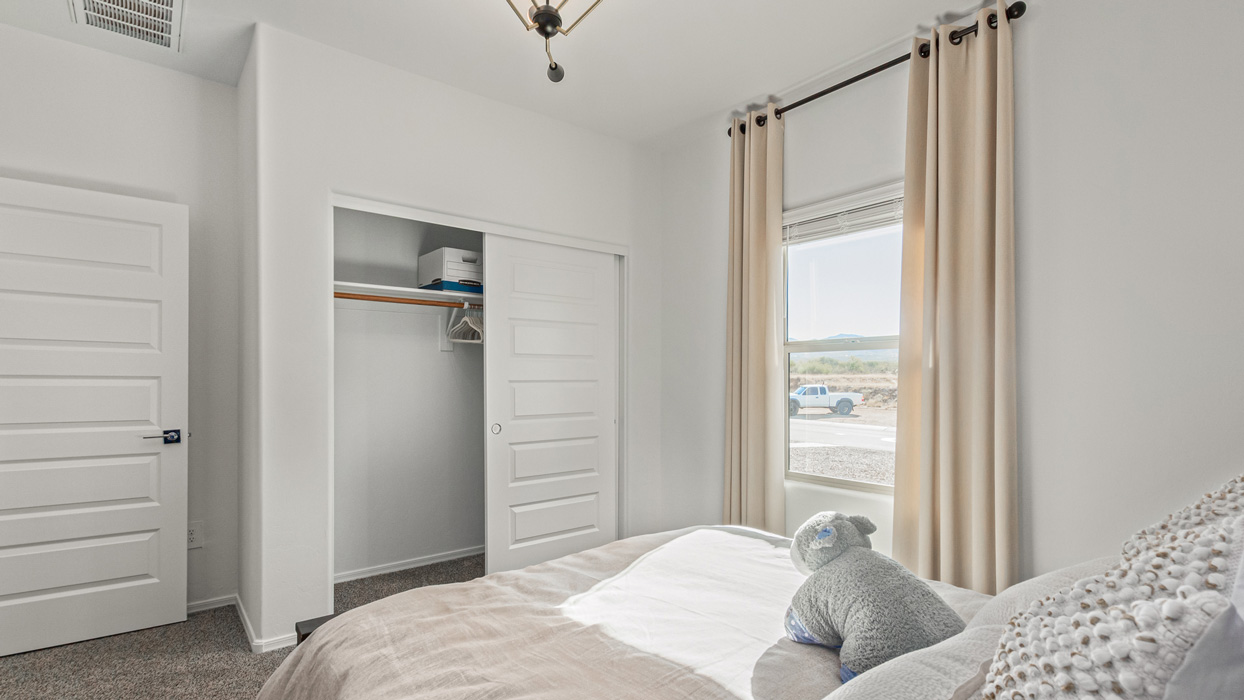 Welcome to the Kingston, a premier new home design situated in the picturesque Sycamore Vista community in Vail, Arizona. With an expansive 2,051 square feet of living space, this single-story home offers four bedrooms, two bathrooms, and a two-three car garage.  As you step inside, you are greeted by an inviting entryway that flows seamlessly into a heart of the home. The open-concept kitchen, equipped with a center island, modern appliances, and ample pantry space, makes it ideal for culinary adventures. Adjacent to the kitchen, the dining room offers easy access to the covered patio, where you can enjoy outdoor dining or simply relax in the tranquility of your private backyard.  The Kingston’s thoughtful layout ensures that every bedroom offers comfort and privacy. The primary suite, located at the rear of the home, features a large walk-in closet and an en-suite bathroom. The additional bedrooms are thoughtfully arranged to provide flexibility, whether you need a guest room, home office, or space for hobbies.  The Kingston is built with a focus on energy efficiency, featuring top-of-the-line insulation, energy-efficient appliances, and a smart home package that includes an automated thermostat, keyless entry, a Wi-Fi-enabled garage door opener, and more. This modern home not only offers comfort but also provides peace of mind with its energy-saving features and enhanced security systems.  Residents of Sycamore Vista enjoy a harmonious blend of rural tranquility and convenient urban access. With proximity to outdoor attractions like Coronado National Forest and Colossal Cave Mountain Park, as well as nearby schools and major employers, Sycamore Vista provides a unique living experience where nature and modern living coexist.  The Kingston at Sycamore Vista is more than just a house—it's a place to create lasting memories and live your best life.  *Images shown are for reference only. They depict the sales model home and may not represent the actual home.