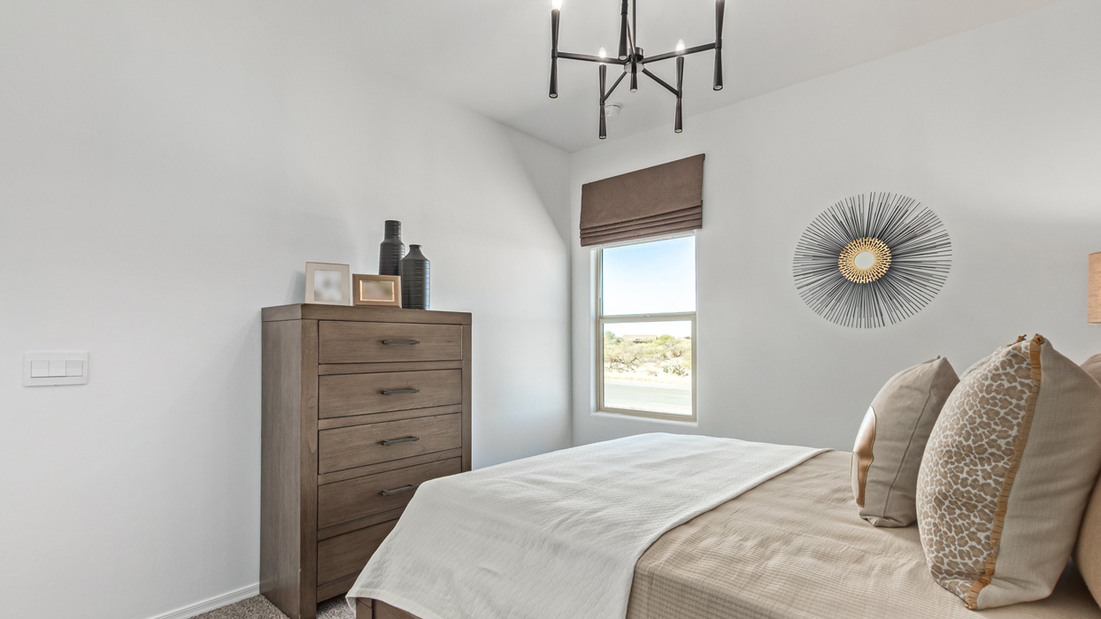 Welcome to the Kingston, a premier new home design situated in the picturesque Sycamore Vista community in Vail, Arizona. With an expansive 2,051 square feet of living space, this single-story home offers four bedrooms, two bathrooms, and a two-three car garage.  As you step inside, you are greeted by an inviting entryway that flows seamlessly into a heart of the home. The open-concept kitchen, equipped with a center island, modern appliances, and ample pantry space, makes it ideal for culinary adventures. Adjacent to the kitchen, the dining room offers easy access to the covered patio, where you can enjoy outdoor dining or simply relax in the tranquility of your private backyard.  The Kingston’s thoughtful layout ensures that every bedroom offers comfort and privacy. The primary suite, located at the rear of the home, features a large walk-in closet and an en-suite bathroom. The additional bedrooms are thoughtfully arranged to provide flexibility, whether you need a guest room, home office, or space for hobbies.  The Kingston is built with a focus on energy efficiency, featuring top-of-the-line insulation, energy-efficient appliances, and a smart home package that includes an automated thermostat, keyless entry, a Wi-Fi-enabled garage door opener, and more. This modern home not only offers comfort but also provides peace of mind with its energy-saving features and enhanced security systems.  Residents of Sycamore Vista enjoy a harmonious blend of rural tranquility and convenient urban access. With proximity to outdoor attractions like Coronado National Forest and Colossal Cave Mountain Park, as well as nearby schools and major employers, Sycamore Vista provides a unique living experience where nature and modern living coexist.  The Kingston at Sycamore Vista is more than just a house—it's a place to create lasting memories and live your best life.  *Images shown are for reference only. They depict the sales model home and may not represent the actual home.