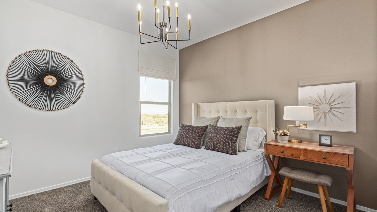 Welcome to the Kingston, a premier new home design situated in the picturesque Sycamore Vista community in Vail, Arizona. With an expansive 2,051 square feet of living space, this single-story home offers four bedrooms, two bathrooms, and a two-three car garage.  As you step inside, you are greeted by an inviting entryway that flows seamlessly into a heart of the home. The open-concept kitchen, equipped with a center island, modern appliances, and ample pantry space, makes it ideal for culinary adventures. Adjacent to the kitchen, the dining room offers easy access to the covered patio, where you can enjoy outdoor dining or simply relax in the tranquility of your private backyard.  The Kingston’s thoughtful layout ensures that every bedroom offers comfort and privacy. The primary suite, located at the rear of the home, features a large walk-in closet and an en-suite bathroom. The additional bedrooms are thoughtfully arranged to provide flexibility, whether you need a guest room, home office, or space for hobbies.  The Kingston is built with a focus on energy efficiency, featuring top-of-the-line insulation, energy-efficient appliances, and a smart home package that includes an automated thermostat, keyless entry, a Wi-Fi-enabled garage door opener, and more. This modern home not only offers comfort but also provides peace of mind with its energy-saving features and enhanced security systems.  Residents of Sycamore Vista enjoy a harmonious blend of rural tranquility and convenient urban access. With proximity to outdoor attractions like Coronado National Forest and Colossal Cave Mountain Park, as well as nearby schools and major employers, Sycamore Vista provides a unique living experience where nature and modern living coexist.  The Kingston at Sycamore Vista is more than just a house—it's a place to create lasting memories and live your best life.  *Images shown are for reference only. They depict the sales model home and may not represent the actual home.