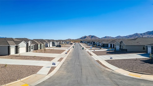 Welcome to Sycamore Vista, a serene new home community by D.R. Horton, nestled in the picturesque foothills of the Santa Rita Mountains. This new phase of Sycamore Vista offers seven thoughtfully designed, single-story floor plans, perfectly paired with breathtaking mountain views and stunning sunsets. Located in the highly sought-after Vail School District, Sycamore Vista is just around the corner from Corona Foothills Middle School, Sycamore Elementary School, and Copper Ridge Elementary School, making it an ideal choice for families. Each new home at Sycamore Vista is crafted with spacious living in mind, featuring large backyards, 3-car garage options, and wide spaces between neighbors, ensuring privacy and tranquility. The homes come with beautifully landscaped front yards equipped with auto drip irrigation systems and soft water loops, adding both convenience and beauty to your outdoor spaces. Enjoy easy access to your outdoor living area through the 6x8 ft backdoor sliders that lead to the back patio, perfect for entertaining or simply relaxing. Additionally, many homes offer double gate options to the backyard, providing extra convenience for accessing and utilizing your expansive yard. Inside, you'll find luxury finishes, including staggered wood-look ceramic tile flooring throughout most areas, granite countertops in the kitchens and bathrooms, and Shaker-style cabinets. The open, single basin stainless steel kitchen sinks, paired with water filtration systems, enhance the functionality and style of your kitchen. Energy efficiency is at the forefront of Sycamore Vista’s new homes. Each home is a DOE Zero Energy Ready Home, featuring spray foam insulation, tankless water heaters, and LED lighting throughout, ensuring lower energy costs and a smaller carbon footprint. The Home is Connected® Smart Home package includes a smart thermostat, video doorbell, keyless entry, and a wifi-enabled garage door opener and more, offering modern conveniences that simplify daily life. With its higher elevation, the community enjoys cooler summer temperatures and less light pollution, making it a perfect spot for stargazing. Outdoor enthusiasts will appreciate the proximity to local, state, and national parks, including Coronado National Forest, Colossal Cave Mountain Park, and Kartchner Caverns State Park, offering endless opportunities for hiking, biking, and camping. Sycamore Vista is ideally located for those who value both tranquility and convenience. This community is a peaceful retreat from the hustle and bustle of city life, yet still provides easy access to shopping, dining, and major employers like the Target Distribution Center and the Amazon Fulfillment Center. Sycamore Vista is just minutes away from major highways, providing easy access to Tucson’s vibrant city life while allowing you to return home to a peaceful, rural setting. Experience the best of Arizona living at Sycamore Vista, where quality craftsmanship, modern amenities, and the beauty of nature come together to create the perfect place to call home.