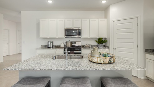 Welcome to Casas del Cerrito, an exclusive new home community by D.R. Horton, perfectly situated on Tucson’s highly sought-after east side. Designed for those who crave a blend of modern convenience, natural beauty, and top-notch education, this community offers the ideal setting for your next chapter. Nestled against the backdrop of breathtaking mountain views, Casas del Cerrito provides easy access to everything that makes Tucson a desirable place to live. Whether you’re heading to work or exploring the great outdoors, you’re never far from what you need. Enjoy quick access to major employers like Davis-Monthan Air Force Base, Raytheon, and Pima Community College East Campus, ensuring your commute is a breeze. Families will appreciate the proximity to exceptional schools, including the esteemed Leman Academy of Excellence and Legacy Traditional School, both located within a mile of the community. With these top-tier schools just around the corner, you can rest assured your children will receive an exceptional education. Outdoor enthusiasts will love being just minutes from Saguaro National Park East, where you can explore miles of hiking and biking trails, admire the majestic saguaro cacti, and take in the stunning desert landscapes. Casas del Cerrito is also close to Lincoln Park, Agua Caliente Regional Park, Mount Lemmon, Reddington Pass, Tanque Verde Falls, multiple Dog Parks, and so much more! Casas del Cerrito is more than just a place to live—it’s a place to thrive. Our homes range from 3 to 5 bedrooms and feature modern, energy-efficient designs that meet the DOE Zero Energy Ready Home standards. Each home is equipped with our signature Home Is Connected Smart Home Package, giving you control and peace of mind. Standard features include elegant granite countertops in kitchens and bathrooms, 18”x18” tile flooring throughout all areas except bedrooms, and spacious walk-in closets in the primary suites. The homes also offer larger lots, pool-ready and perfect for your backyard dreams. The Spanish lace stucco exteriors, tile roofs, and professionally landscaped front yards with auto-drip irrigation add to the curb appeal. For those who enjoy recreational activities, Casas del Cerrito is surrounded by a plethora of options. Tee off at Fred Enke Golf Course, ride the trails at nearby mountain bike parks, or enjoy a day at one of the many stables like Raven Ranch and Sonoran Stables. When it’s time to relax, visit nearby attractions like Trail Dust Town, Park Place Mall, or catch a movie at Galaxy Theatres. Casas del Cerrito offers a unique blend of urban convenience and natural serenity, making it the perfect place to call home. Join this vibrant community and start living the lifestyle you’ve always dreamed of.