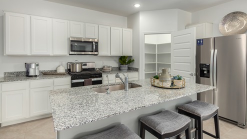 Welcome to Casas del Cerrito, an exclusive new home community by D.R. Horton, perfectly situated on Tucson’s highly sought-after east side. Designed for those who crave a blend of modern convenience, natural beauty, and top-notch education, this community offers the ideal setting for your next chapter. Nestled against the backdrop of breathtaking mountain views, Casas del Cerrito provides easy access to everything that makes Tucson a desirable place to live. Whether you’re heading to work or exploring the great outdoors, you’re never far from what you need. Enjoy quick access to major employers like Davis-Monthan Air Force Base, Raytheon, and Pima Community College East Campus, ensuring your commute is a breeze. Families will appreciate the proximity to exceptional schools, including the esteemed Leman Academy of Excellence and Legacy Traditional School, both located within a mile of the community. With these top-tier schools just around the corner, you can rest assured your children will receive an exceptional education. Outdoor enthusiasts will love being just minutes from Saguaro National Park East, where you can explore miles of hiking and biking trails, admire the majestic saguaro cacti, and take in the stunning desert landscapes. Casas del Cerrito is also close to Lincoln Park, Agua Caliente Regional Park, Mount Lemmon, Reddington Pass, Tanque Verde Falls, multiple Dog Parks, and so much more! Casas del Cerrito is more than just a place to live—it’s a place to thrive. Our homes range from 3 to 5 bedrooms and feature modern, energy-efficient designs that meet the DOE Zero Energy Ready Home standards. Each home is equipped with our signature Home Is Connected Smart Home Package, giving you control and peace of mind. Standard features include elegant granite countertops in kitchens and bathrooms, 18”x18” tile flooring throughout all areas except bedrooms, and spacious walk-in closets in the primary suites. The homes also offer larger lots, pool-ready and perfect for your backyard dreams. The Spanish lace stucco exteriors, tile roofs, and professionally landscaped front yards with auto-drip irrigation add to the curb appeal. For those who enjoy recreational activities, Casas del Cerrito is surrounded by a plethora of options. Tee off at Fred Enke Golf Course, ride the trails at nearby mountain bike parks, or enjoy a day at one of the many stables like Raven Ranch and Sonoran Stables. When it’s time to relax, visit nearby attractions like Trail Dust Town, Park Place Mall, or catch a movie at Galaxy Theatres. Casas del Cerrito offers a unique blend of urban convenience and natural serenity, making it the perfect place to call home. Join this vibrant community and start living the lifestyle you’ve always dreamed of.