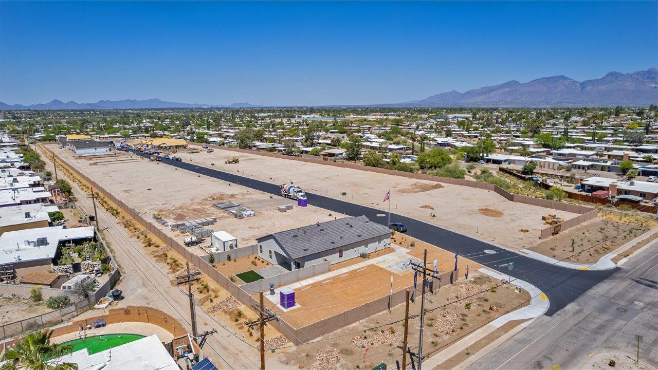 Step into The Baxter at Casas del Cerrito in Tucson, Arizona – a beautifully designed 1,423 sq. ft. single-story new home that perfectly blends modern convenience with the serene beauty of the surrounding desert landscape.  As you enter through the welcoming front porch, you’re greeted by a thoughtfully planned entryway that leads into the heart of the home – a spacious and open-concept great room. This central living area flows seamlessly into the dining space, creating an ideal environment for both entertaining and everyday family life.  The gourmet kitchen, situated adjacent to the dining room, features elegant granite countertops, a large island with a breakfast bar, modern appliances, and a walk-in pantry, providing ample storage and a perfect space for culinary creativity.  The master suite, located at the rear of the home for added privacy, offers a generous walk-in closet and a luxurious en-suite bathroom with dual vanities and a walk-in shower. Large windows allow plenty of natural light to fill the space, creating a tranquil retreat.  Two additional bedrooms are positioned near the front of the home, each with easy access to a full bathroom. These rooms are perfect for family members, guests, or a home office, offering flexibility to suit your lifestyle.  For added convenience, the home includes a utility room and a two-car garage, ensuring that daily routines are efficient and organized.  Step outside to the covered patio, where you can relax and enjoy the stunning mountain views and Tucson’s beautiful weather year-round. Whether you’re hosting a weekend barbecue or enjoying a quiet evening outdoors, this space extends your living area into the peaceful surroundings of Casas del Cerrito.  Designed with energy efficiency in mind, The Baxter at Casas del Cerrito is a DOE Zero Energy Ready Home, ensuring long-term savings and a sustainable living environment.