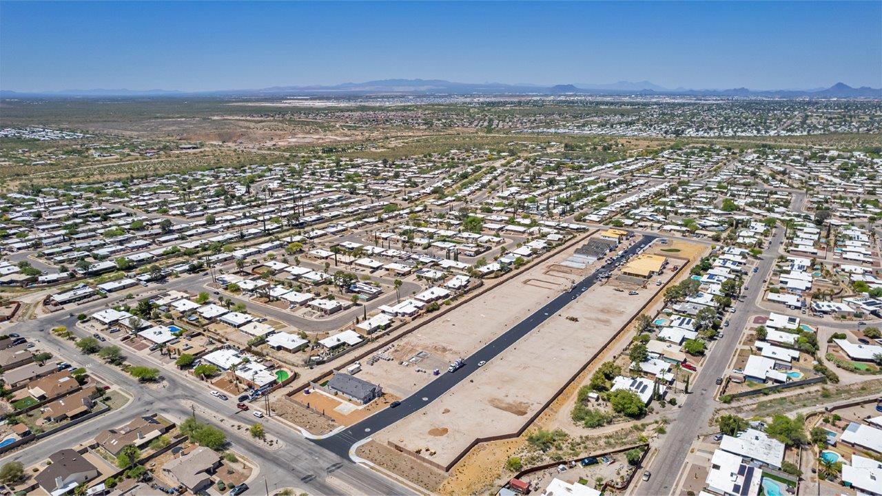 Step into The Baxter at Casas del Cerrito in Tucson, Arizona – a beautifully designed 1,423 sq. ft. single-story new home that perfectly blends modern convenience with the serene beauty of the surrounding desert landscape.  As you enter through the welcoming front porch, you’re greeted by a thoughtfully planned entryway that leads into the heart of the home – a spacious and open-concept great room. This central living area flows seamlessly into the dining space, creating an ideal environment for both entertaining and everyday family life.  The gourmet kitchen, situated adjacent to the dining room, features elegant granite countertops, a large island with a breakfast bar, modern appliances, and a walk-in pantry, providing ample storage and a perfect space for culinary creativity.  The master suite, located at the rear of the home for added privacy, offers a generous walk-in closet and a luxurious en-suite bathroom with dual vanities and a walk-in shower. Large windows allow plenty of natural light to fill the space, creating a tranquil retreat.  Two additional bedrooms are positioned near the front of the home, each with easy access to a full bathroom. These rooms are perfect for family members, guests, or a home office, offering flexibility to suit your lifestyle.  For added convenience, the home includes a utility room and a two-car garage, ensuring that daily routines are efficient and organized.  Step outside to the covered patio, where you can relax and enjoy the stunning mountain views and Tucson’s beautiful weather year-round. Whether you’re hosting a weekend barbecue or enjoying a quiet evening outdoors, this space extends your living area into the peaceful surroundings of Casas del Cerrito.  Designed with energy efficiency in mind, The Baxter at Casas del Cerrito is a DOE Zero Energy Ready Home, ensuring long-term savings and a sustainable living environment.