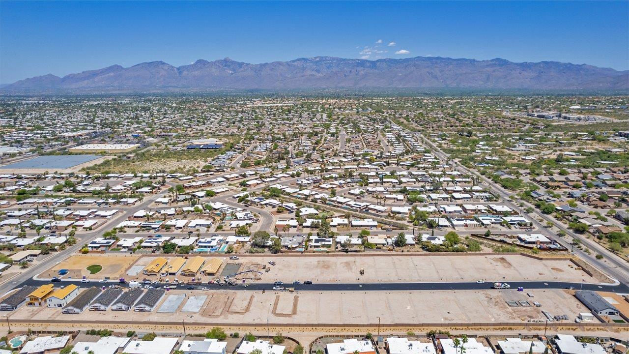 Step into The Baxter at Casas del Cerrito in Tucson, Arizona – a beautifully designed 1,423 sq. ft. single-story new home that perfectly blends modern convenience with the serene beauty of the surrounding desert landscape.  As you enter through the welcoming front porch, you’re greeted by a thoughtfully planned entryway that leads into the heart of the home – a spacious and open-concept great room. This central living area flows seamlessly into the dining space, creating an ideal environment for both entertaining and everyday family life.  The gourmet kitchen, situated adjacent to the dining room, features elegant granite countertops, a large island with a breakfast bar, modern appliances, and a walk-in pantry, providing ample storage and a perfect space for culinary creativity.  The master suite, located at the rear of the home for added privacy, offers a generous walk-in closet and a luxurious en-suite bathroom with dual vanities and a walk-in shower. Large windows allow plenty of natural light to fill the space, creating a tranquil retreat.  Two additional bedrooms are positioned near the front of the home, each with easy access to a full bathroom. These rooms are perfect for family members, guests, or a home office, offering flexibility to suit your lifestyle.  For added convenience, the home includes a utility room and a two-car garage, ensuring that daily routines are efficient and organized.  Step outside to the covered patio, where you can relax and enjoy the stunning mountain views and Tucson’s beautiful weather year-round. Whether you’re hosting a weekend barbecue or enjoying a quiet evening outdoors, this space extends your living area into the peaceful surroundings of Casas del Cerrito.  Designed with energy efficiency in mind, The Baxter at Casas del Cerrito is a DOE Zero Energy Ready Home, ensuring long-term savings and a sustainable living environment.