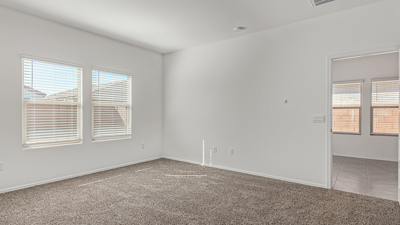 Step into The Baxter at Casas del Cerrito in Tucson, Arizona – a beautifully designed 1,423 sq. ft. single-story new home that perfectly blends modern convenience with the serene beauty of the surrounding desert landscape.  As you enter through the welcoming front porch, you’re greeted by a thoughtfully planned entryway that leads into the heart of the home – a spacious and open-concept great room. This central living area flows seamlessly into the dining space, creating an ideal environment for both entertaining and everyday family life.  The gourmet kitchen, situated adjacent to the dining room, features elegant granite countertops, a large island with a breakfast bar, modern appliances, and a walk-in pantry, providing ample storage and a perfect space for culinary creativity.  The master suite, located at the rear of the home for added privacy, offers a generous walk-in closet and a luxurious en-suite bathroom with dual vanities and a walk-in shower. Large windows allow plenty of natural light to fill the space, creating a tranquil retreat.  Two additional bedrooms are positioned near the front of the home, each with easy access to a full bathroom. These rooms are perfect for family members, guests, or a home office, offering flexibility to suit your lifestyle.  For added convenience, the home includes a utility room and a two-car garage, ensuring that daily routines are efficient and organized.  Step outside to the covered patio, where you can relax and enjoy the stunning mountain views and Tucson’s beautiful weather year-round. Whether you’re hosting a weekend barbecue or enjoying a quiet evening outdoors, this space extends your living area into the peaceful surroundings of Casas del Cerrito.  Designed with energy efficiency in mind, The Baxter at Casas del Cerrito is a DOE Zero Energy Ready Home, ensuring long-term savings and a sustainable living environment.