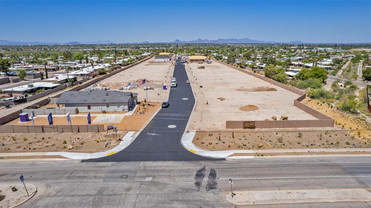 Welcome to The Easton at Casas del Cerrito in Tucson, Arizona – a spacious 1,701 sq. ft. single-story new home that offers a perfect blend of modern convenience and serene desert living.  As you enter through the charming front porch, you’re greeted by a thoughtfully designed entryway that opens up into an expansive great room. This central living area seamlessly connects to the dining room and kitchen, creating an open-concept space that is perfect for entertaining and daily family life.  The kitchen is both stylish and functional, featuring elegant granite countertops, a large island with a breakfast bar, modern appliances, and a walk-in pantry that provides ample storage space. The flow from the kitchen to the dining area and great room ensures that everyone stays connected, whether you’re preparing meals, dining, or relaxing.  Step outside to the covered patio, where you can enjoy Tucson’s breathtaking mountain views and beautiful weather year-round. Whether you’re hosting a party or simply unwinding after a long day, this outdoor space extends your living area into the tranquil surroundings of Casas del Cerrito.  The master suite, located at the back of the home, offers a private retreat with a spacious bedroom, a large walk-in closet, and an en-suite bathroom complete with dual vanities and a walk-in shower. This peaceful sanctuary is designed for comfort and relaxation.  The Easton also includes three additional bedrooms, each offering plenty of space and natural light. These rooms are conveniently located near the second full bathroom, making it easy to accommodate family members and guests alike. For added convenience, the home features a utility room and direct access to a two-car garage, ensuring that daily routines are smooth and efficient.  Designed with energy efficiency in mind, The Easton at Casas del Cerrito is a DOE Zero Energy Ready Home, offering sustainability, comfort, and long-term savings.