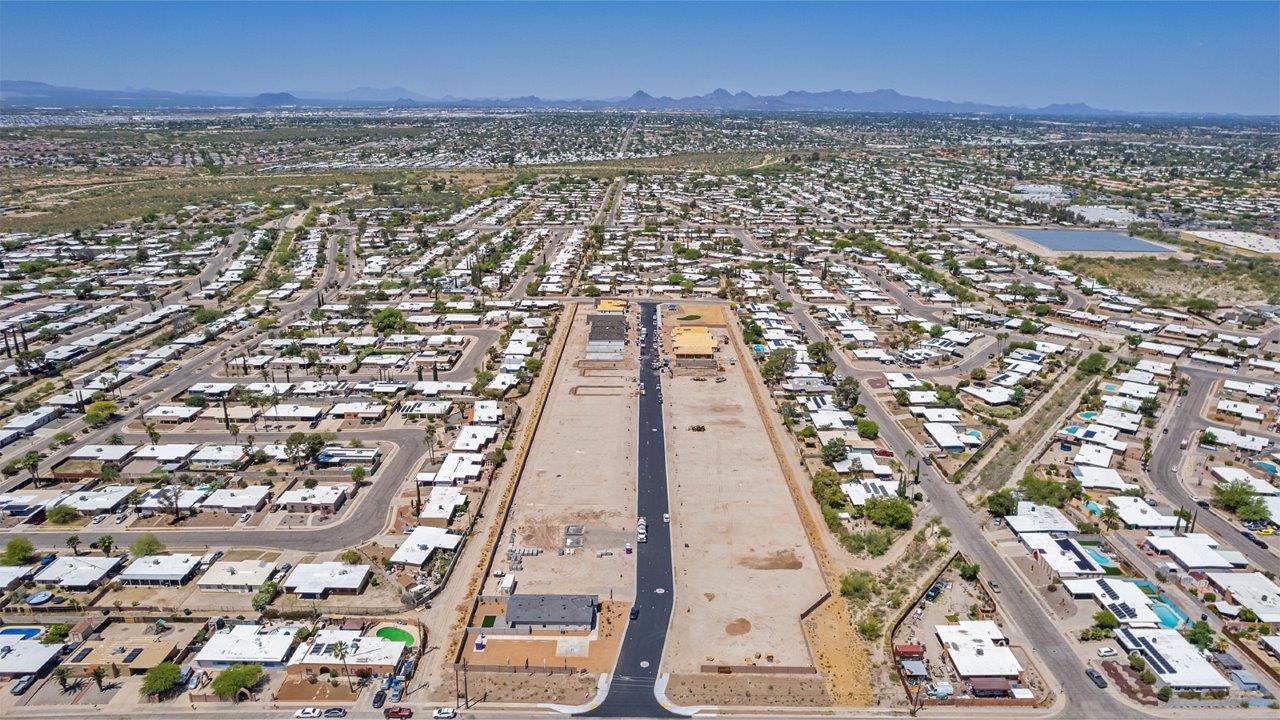 Welcome to The Easton at Casas del Cerrito in Tucson, Arizona – a spacious 1,701 sq. ft. single-story new home that offers a perfect blend of modern convenience and serene desert living.  As you enter through the charming front porch, you’re greeted by a thoughtfully designed entryway that opens up into an expansive great room. This central living area seamlessly connects to the dining room and kitchen, creating an open-concept space that is perfect for entertaining and daily family life.  The kitchen is both stylish and functional, featuring elegant granite countertops, a large island with a breakfast bar, modern appliances, and a walk-in pantry that provides ample storage space. The flow from the kitchen to the dining area and great room ensures that everyone stays connected, whether you’re preparing meals, dining, or relaxing.  Step outside to the covered patio, where you can enjoy Tucson’s breathtaking mountain views and beautiful weather year-round. Whether you’re hosting a party or simply unwinding after a long day, this outdoor space extends your living area into the tranquil surroundings of Casas del Cerrito.  The master suite, located at the back of the home, offers a private retreat with a spacious bedroom, a large walk-in closet, and an en-suite bathroom complete with dual vanities and a walk-in shower. This peaceful sanctuary is designed for comfort and relaxation.  The Easton also includes three additional bedrooms, each offering plenty of space and natural light. These rooms are conveniently located near the second full bathroom, making it easy to accommodate family members and guests alike. For added convenience, the home features a utility room and direct access to a two-car garage, ensuring that daily routines are smooth and efficient.  Designed with energy efficiency in mind, The Easton at Casas del Cerrito is a DOE Zero Energy Ready Home, offering sustainability, comfort, and long-term savings.