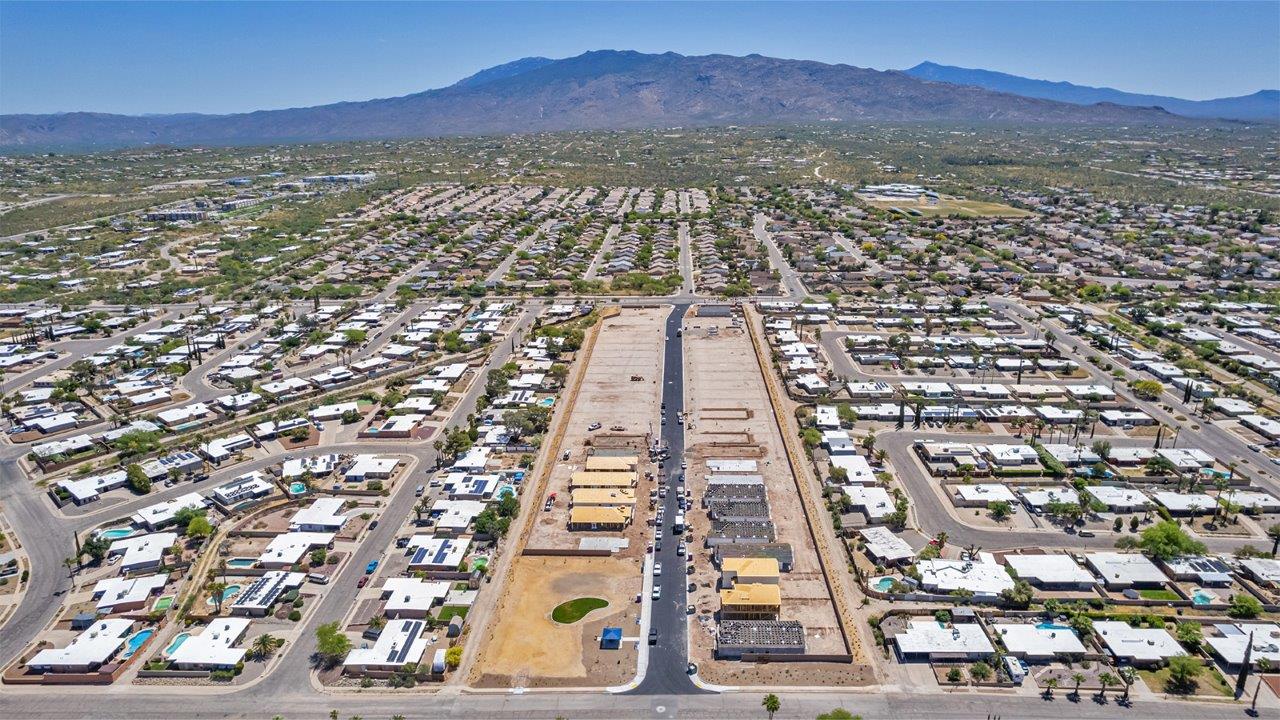 Welcome to The Easton at Casas del Cerrito in Tucson, Arizona – a spacious 1,701 sq. ft. single-story new home that offers a perfect blend of modern convenience and serene desert living.  As you enter through the charming front porch, you’re greeted by a thoughtfully designed entryway that opens up into an expansive great room. This central living area seamlessly connects to the dining room and kitchen, creating an open-concept space that is perfect for entertaining and daily family life.  The kitchen is both stylish and functional, featuring elegant granite countertops, a large island with a breakfast bar, modern appliances, and a walk-in pantry that provides ample storage space. The flow from the kitchen to the dining area and great room ensures that everyone stays connected, whether you’re preparing meals, dining, or relaxing.  Step outside to the covered patio, where you can enjoy Tucson’s breathtaking mountain views and beautiful weather year-round. Whether you’re hosting a party or simply unwinding after a long day, this outdoor space extends your living area into the tranquil surroundings of Casas del Cerrito.  The master suite, located at the back of the home, offers a private retreat with a spacious bedroom, a large walk-in closet, and an en-suite bathroom complete with dual vanities and a walk-in shower. This peaceful sanctuary is designed for comfort and relaxation.  The Easton also includes three additional bedrooms, each offering plenty of space and natural light. These rooms are conveniently located near the second full bathroom, making it easy to accommodate family members and guests alike. For added convenience, the home features a utility room and direct access to a two-car garage, ensuring that daily routines are smooth and efficient.  Designed with energy efficiency in mind, The Easton at Casas del Cerrito is a DOE Zero Energy Ready Home, offering sustainability, comfort, and long-term savings.