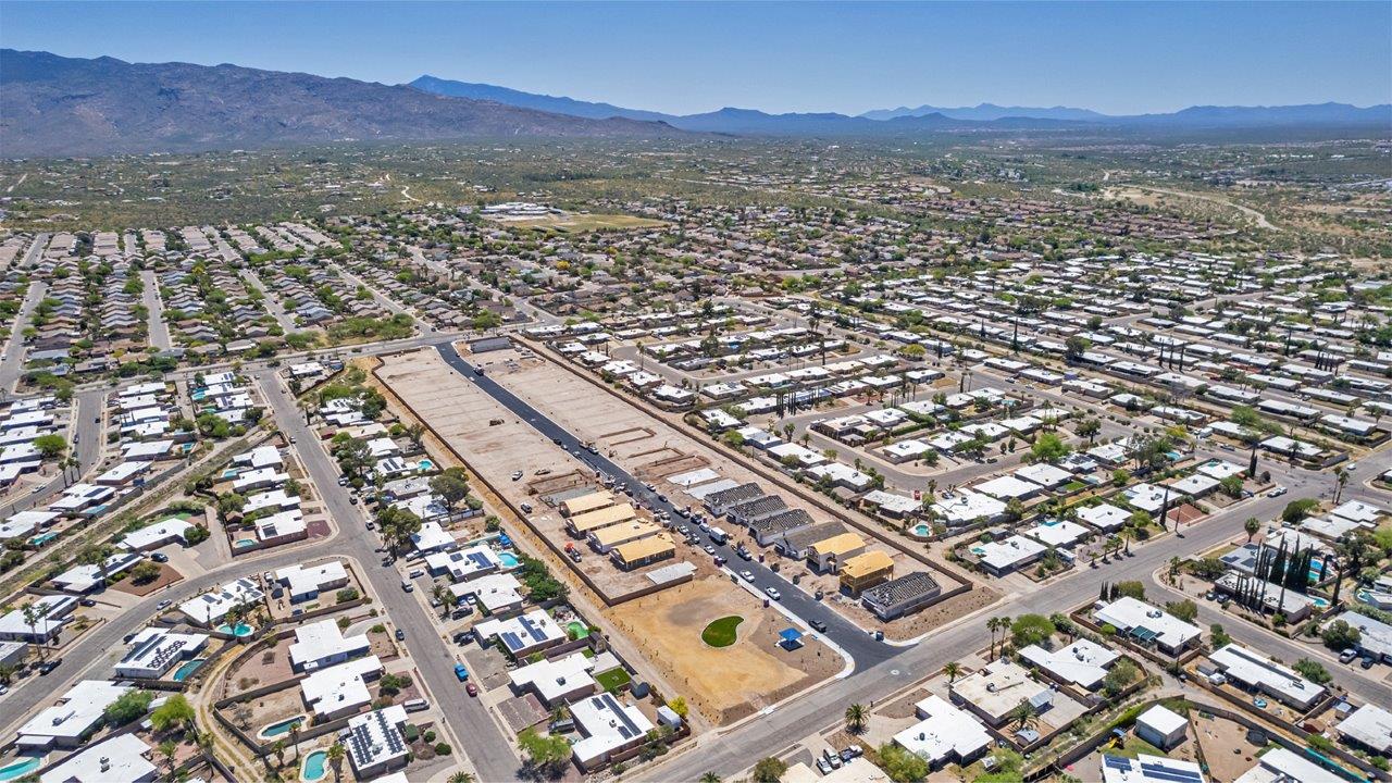 Welcome to The Easton at Casas del Cerrito in Tucson, Arizona – a spacious 1,701 sq. ft. single-story new home that offers a perfect blend of modern convenience and serene desert living.  As you enter through the charming front porch, you’re greeted by a thoughtfully designed entryway that opens up into an expansive great room. This central living area seamlessly connects to the dining room and kitchen, creating an open-concept space that is perfect for entertaining and daily family life.  The kitchen is both stylish and functional, featuring elegant granite countertops, a large island with a breakfast bar, modern appliances, and a walk-in pantry that provides ample storage space. The flow from the kitchen to the dining area and great room ensures that everyone stays connected, whether you’re preparing meals, dining, or relaxing.  Step outside to the covered patio, where you can enjoy Tucson’s breathtaking mountain views and beautiful weather year-round. Whether you’re hosting a party or simply unwinding after a long day, this outdoor space extends your living area into the tranquil surroundings of Casas del Cerrito.  The master suite, located at the back of the home, offers a private retreat with a spacious bedroom, a large walk-in closet, and an en-suite bathroom complete with dual vanities and a walk-in shower. This peaceful sanctuary is designed for comfort and relaxation.  The Easton also includes three additional bedrooms, each offering plenty of space and natural light. These rooms are conveniently located near the second full bathroom, making it easy to accommodate family members and guests alike. For added convenience, the home features a utility room and direct access to a two-car garage, ensuring that daily routines are smooth and efficient.  Designed with energy efficiency in mind, The Easton at Casas del Cerrito is a DOE Zero Energy Ready Home, offering sustainability, comfort, and long-term savings.