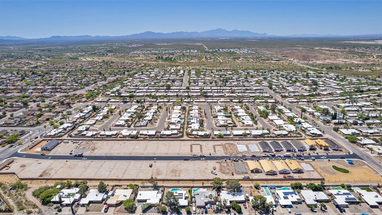 Welcome to The Easton at Casas del Cerrito in Tucson, Arizona – a spacious 1,701 sq. ft. single-story new home that offers a perfect blend of modern convenience and serene desert living.  As you enter through the charming front porch, you’re greeted by a thoughtfully designed entryway that opens up into an expansive great room. This central living area seamlessly connects to the dining room and kitchen, creating an open-concept space that is perfect for entertaining and daily family life.  The kitchen is both stylish and functional, featuring elegant granite countertops, a large island with a breakfast bar, modern appliances, and a walk-in pantry that provides ample storage space. The flow from the kitchen to the dining area and great room ensures that everyone stays connected, whether you’re preparing meals, dining, or relaxing.  Step outside to the covered patio, where you can enjoy Tucson’s breathtaking mountain views and beautiful weather year-round. Whether you’re hosting a party or simply unwinding after a long day, this outdoor space extends your living area into the tranquil surroundings of Casas del Cerrito.  The master suite, located at the back of the home, offers a private retreat with a spacious bedroom, a large walk-in closet, and an en-suite bathroom complete with dual vanities and a walk-in shower. This peaceful sanctuary is designed for comfort and relaxation.  The Easton also includes three additional bedrooms, each offering plenty of space and natural light. These rooms are conveniently located near the second full bathroom, making it easy to accommodate family members and guests alike. For added convenience, the home features a utility room and direct access to a two-car garage, ensuring that daily routines are smooth and efficient.  Designed with energy efficiency in mind, The Easton at Casas del Cerrito is a DOE Zero Energy Ready Home, offering sustainability, comfort, and long-term savings.